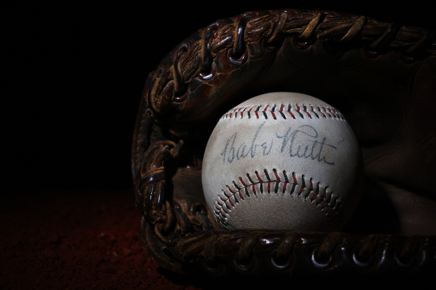 A Babe Ruth signed baseball in a antique vintage baseball mittt. 7th June 2012. Photo Tim Clayton (Photo by Tim Clayton/Corbis via Getty Images)