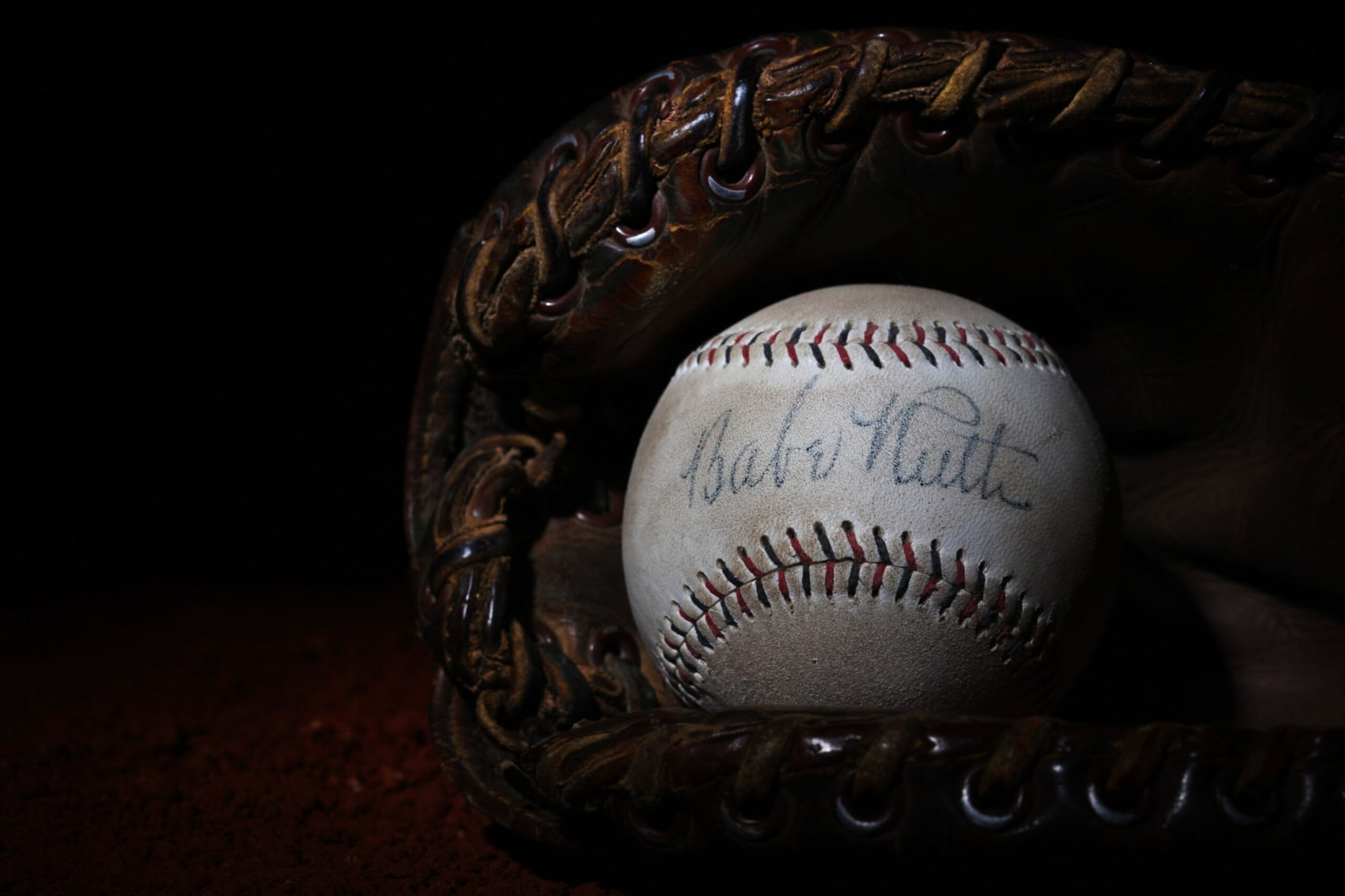 A Babe Ruth signed baseball in a antique vintage baseball mittt. 7th June 2012. Photo Tim Clayton (Photo by Tim Clayton/Corbis via Getty Images) A Babe Ruth signed baseball in a antique vintage baseball mittt. 7th June 2012. Photo Tim Clayton (Photo by Tim Clayton/Corbis via Getty Images)