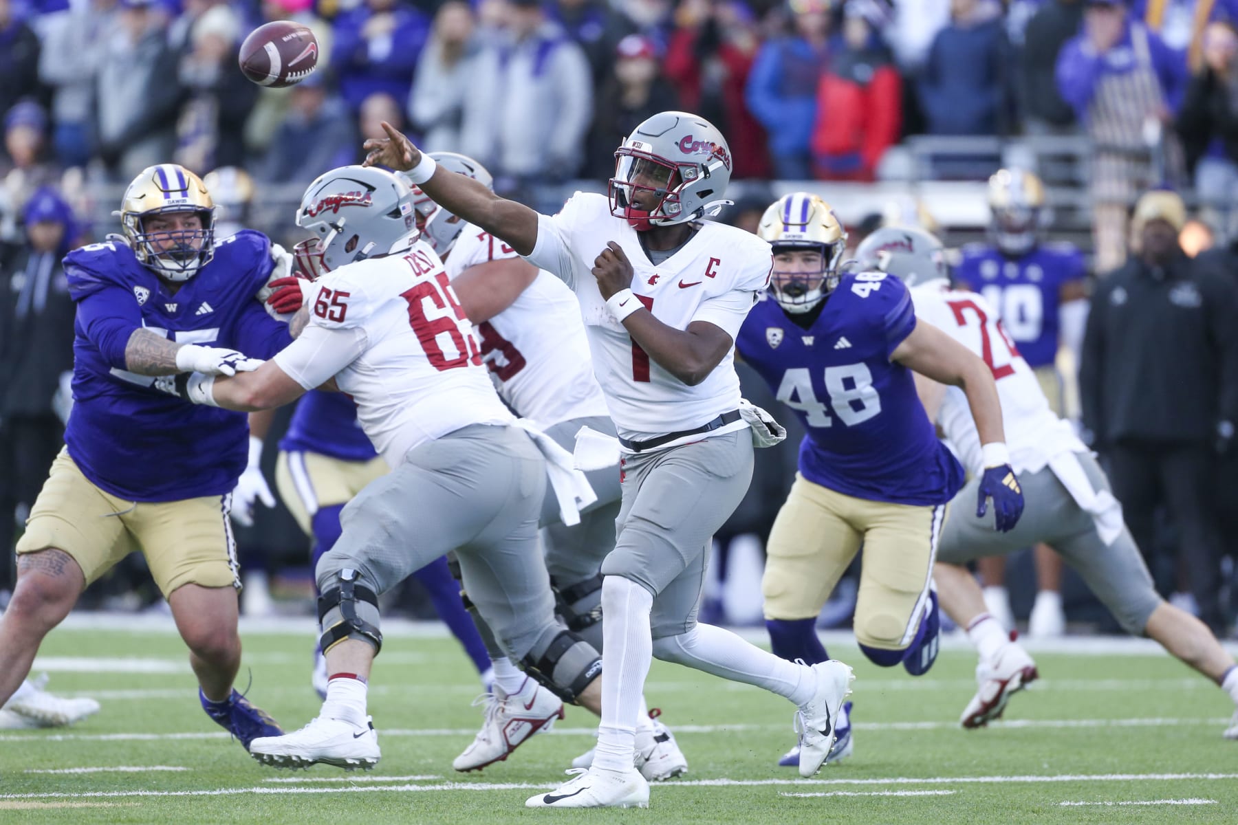 SEATTLE, WA - November 25:  Washington State #1 (QB) Cameron Ward fires the ball down field during the 115 Apple Cup college football game between the Washington Huskies and the Washington State Cougars on November 25, 2023, at Husky Stadium in Seattle, WA. (Photo by Jesse Beals/Icon Sportswire via Getty Images)