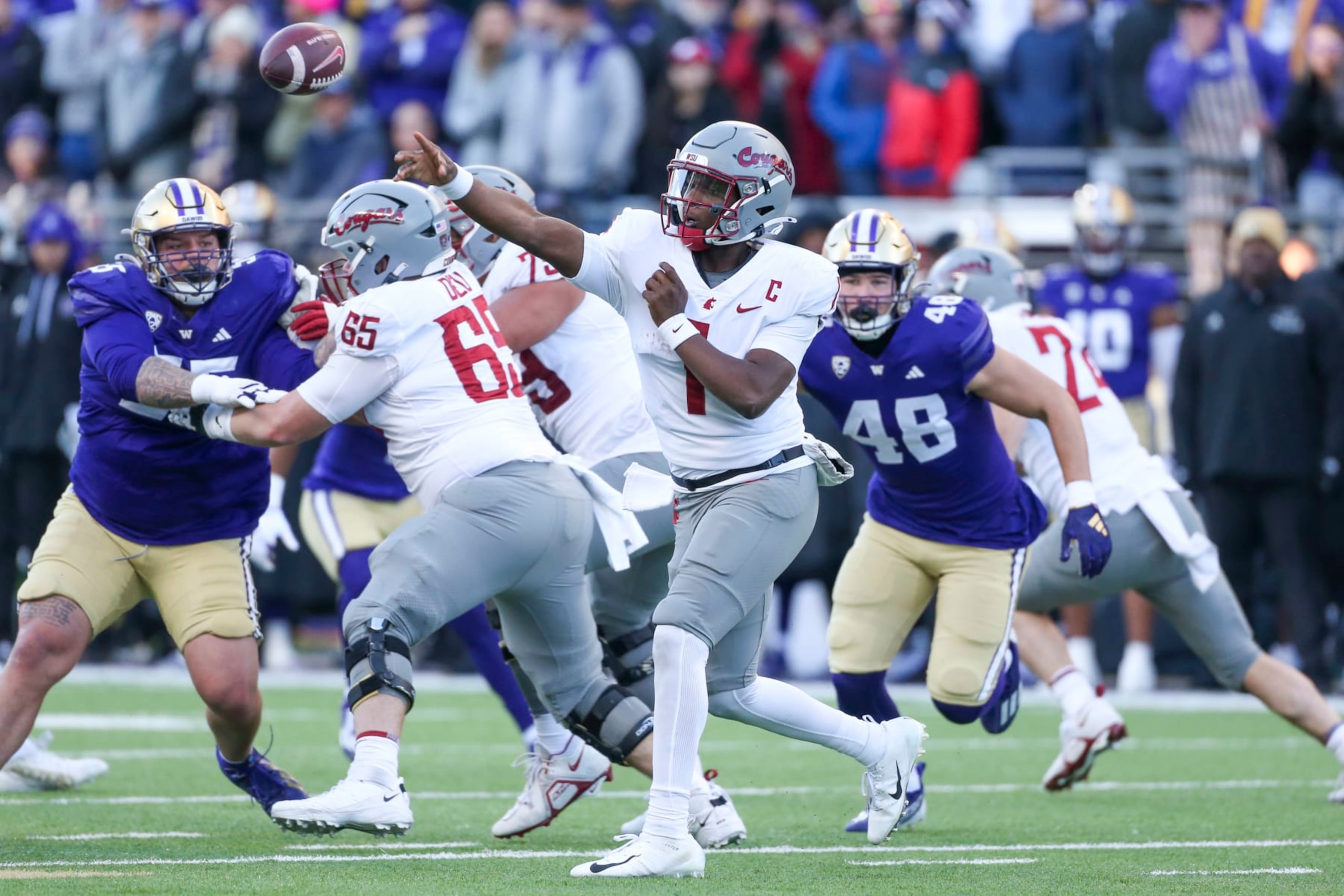 SEATTLE, WA - November 25:  Washington State #1 (QB) Cameron Ward fires the ball down field during the 115 Apple Cup college football game between the Washington Huskies and the Washington State Cougars on November 25, 2023, at Husky Stadium in Seattle, WA. (Photo by Jesse Beals/Icon Sportswire via Getty Images)