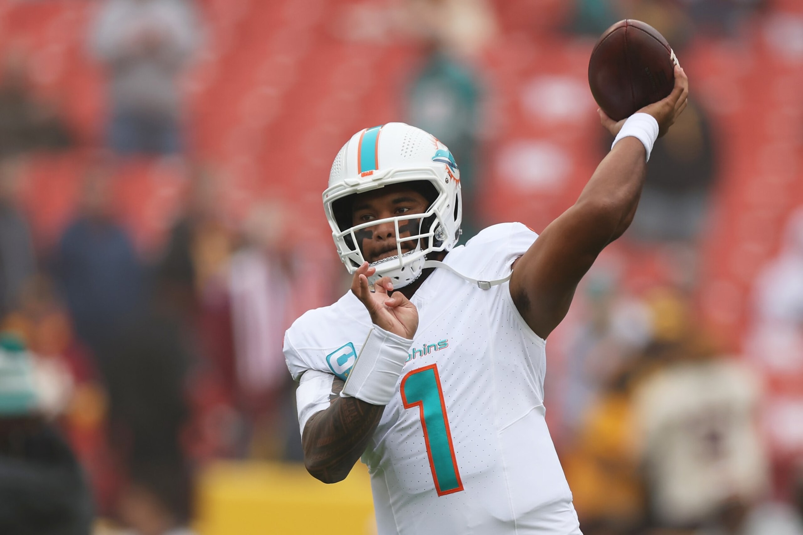 LANDOVER, MARYLAND - DECEMBER 03: Tua Tagovailoa #1 of the Miami Dolphins warms up prior to a game against the Washington Commanders at FedExField on December 03, 2023 in Landover, Maryland. (Photo by Rob Carr/Getty Images)