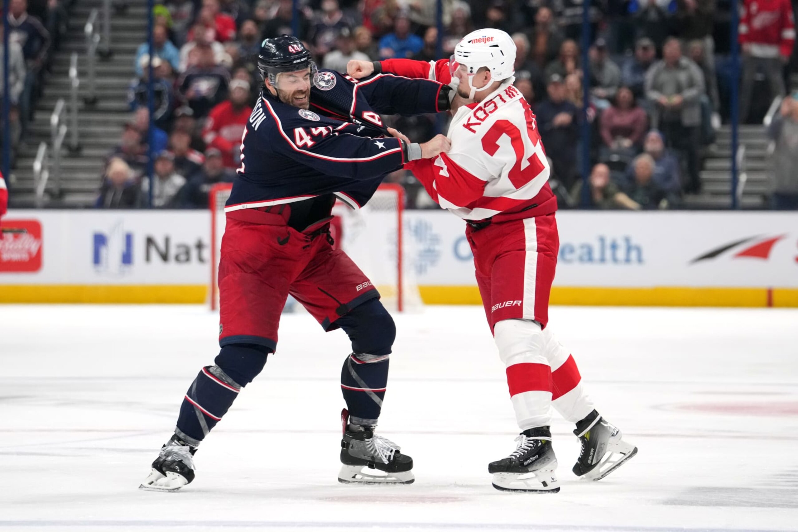 COLUMBUS, OHIO - OCTOBER 16: Erik Gudbranson #44 of the Columbus Blue Jackets and Klim Kostin #24 of the Detroit Red Wings fight during the third period  at Nationwide Arena on October 16, 2023 in Columbus, Ohio. (Photo by Jason Mowry/Getty Images)
