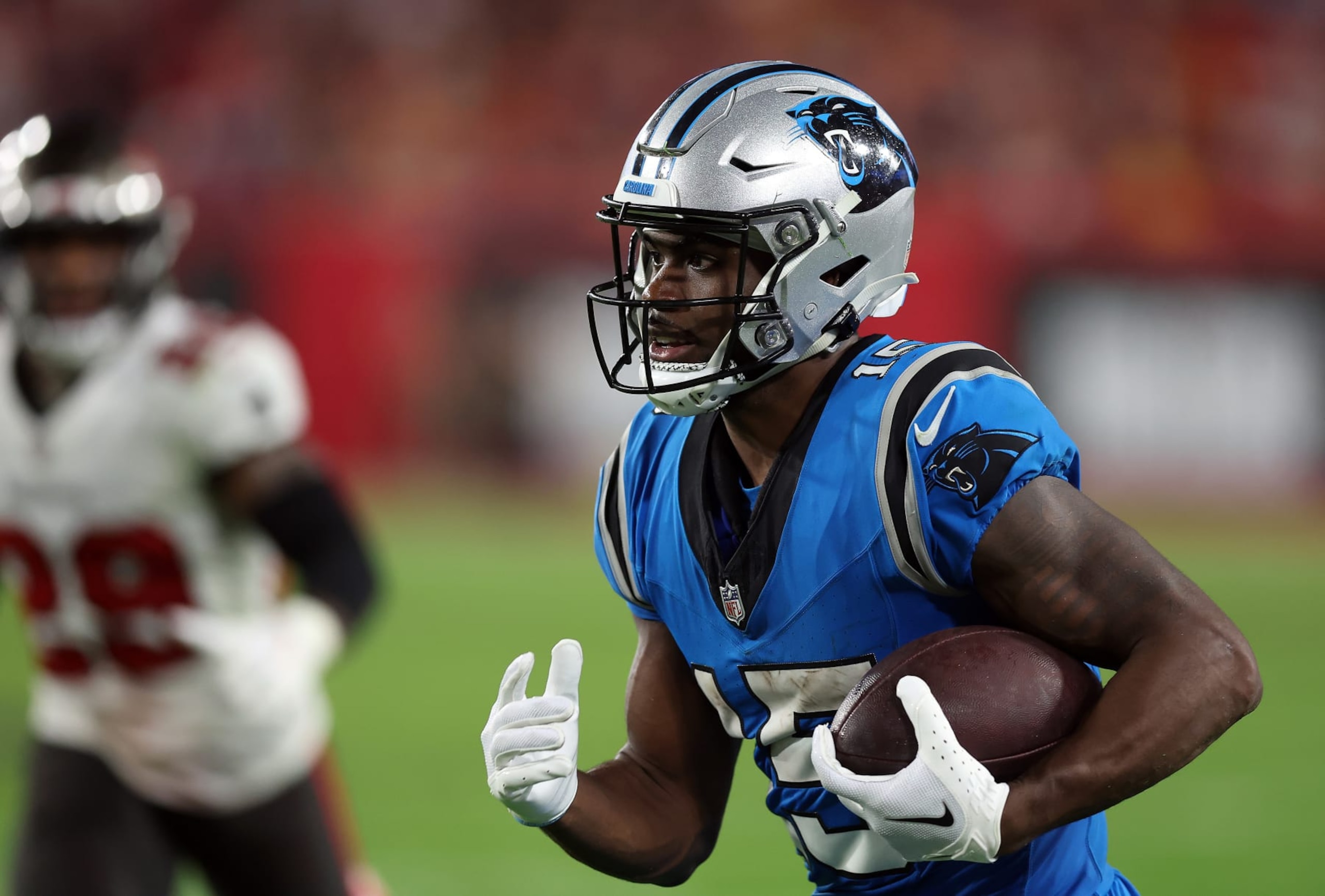 TAMPA, FLORIDA - DECEMBER 03: Jonathan Mingo #15 of the Carolina Panthers carries the ball against the Tampa Bay Buccaneers during the third quarter of the game at Raymond James Stadium on December 03, 2023 in Tampa, Florida. (Photo by Mike Carlson/Getty Images) TAMPA, FLORIDA - DECEMBER 03: Jonathan Mingo #15 of the Carolina Panthers carries the ball against the Tampa Bay Buccaneers during the third quarter of the game at Raymond James Stadium on December 03, 2023 in Tampa, Florida. (Photo by Mike Carlson/Getty Images)