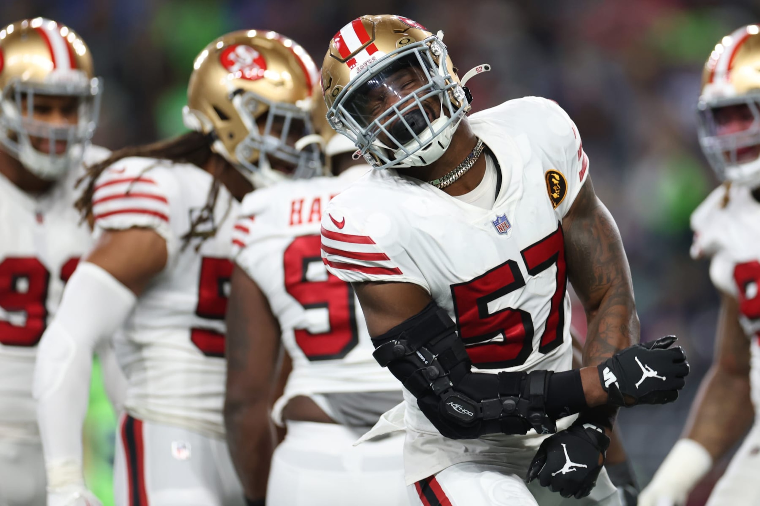 SEATTLE, WASHINGTON - NOVEMBER 23: Dre Greenlaw #57 of the San Francisco 49ers reacts during the second quarter against the Seattle Seahawks at Lumen Field on November 23, 2023 in Seattle, Washington. (Photo by Steph Chambers/Getty Images)