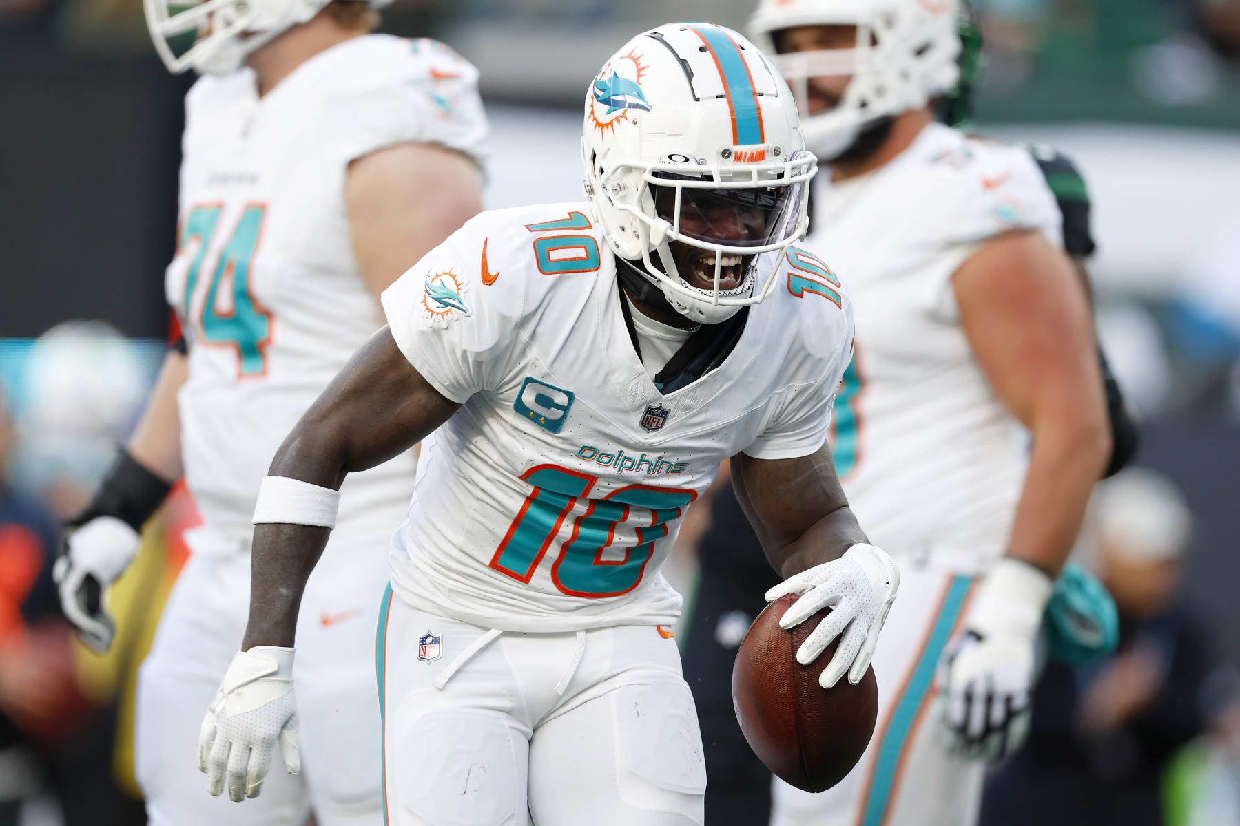 EAST RUTHERFORD, NEW JERSEY - NOVEMBER 24: Tyreek Hill #10 of the Miami Dolphins celebrates a first down catch against the New York Jets during the first quarter in the game at MetLife Stadium on November 24, 2023 in East Rutherford, New Jersey. (Photo by Rich Schultz/Getty Images)