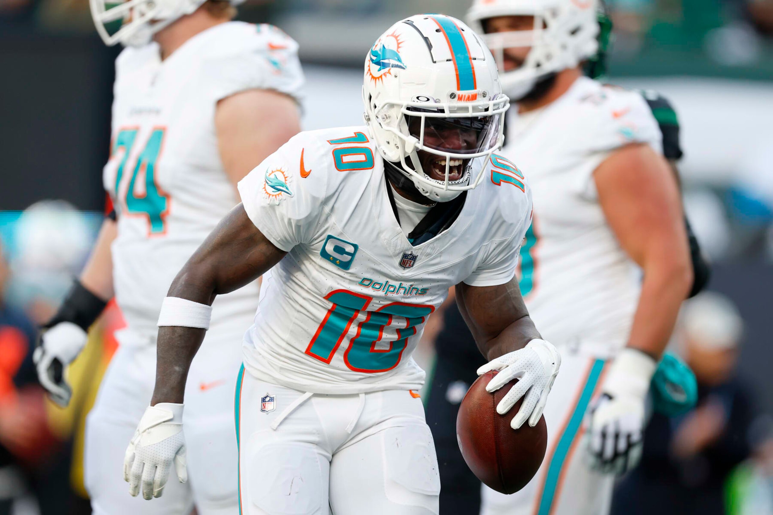 EAST RUTHERFORD, NEW JERSEY - NOVEMBER 24: Tyreek Hill #10 of the Miami Dolphins celebrates a first down catch against the New York Jets during the first quarter in the game at MetLife Stadium on November 24, 2023 in East Rutherford, New Jersey. (Photo by Rich Schultz/Getty Images)