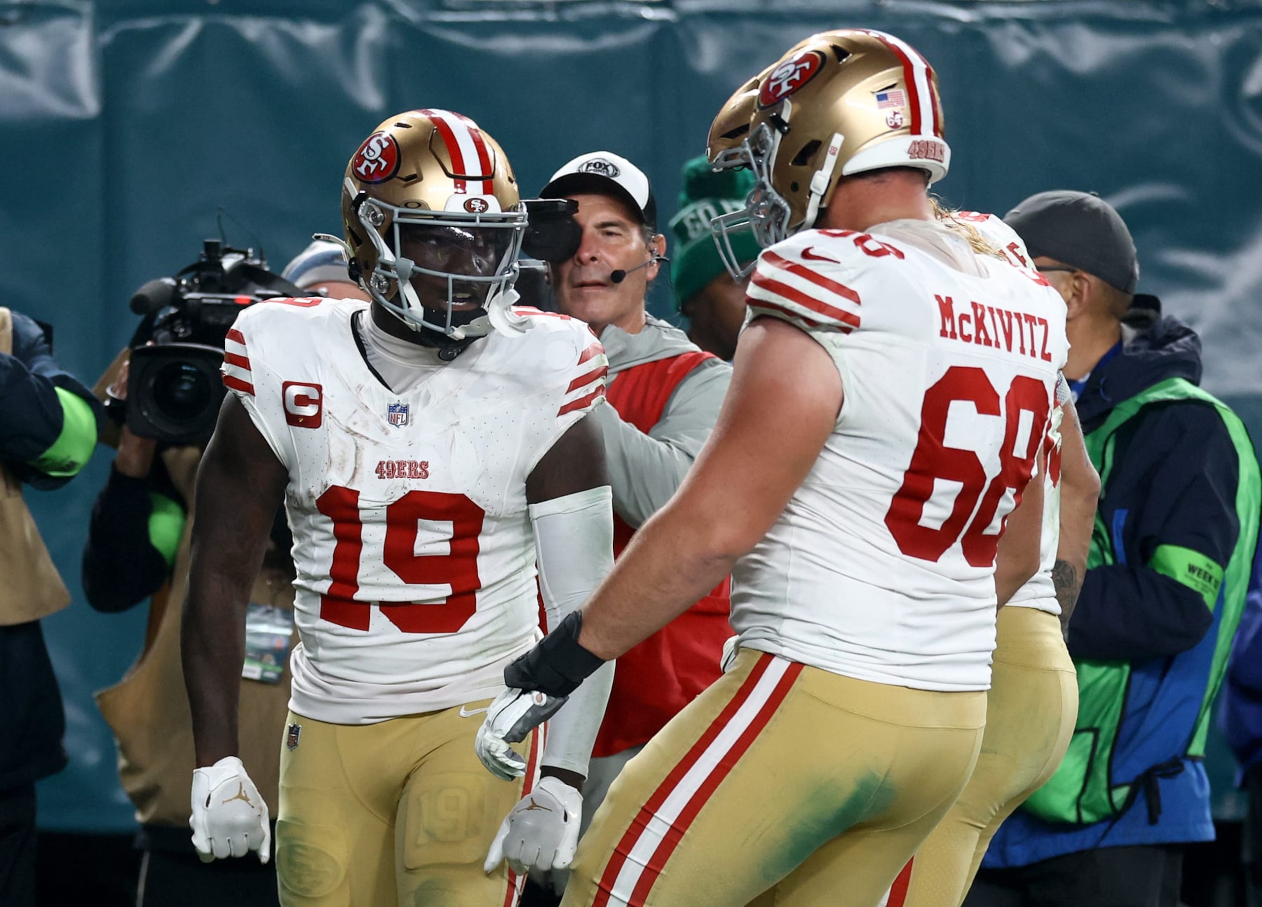 PHILADELPHIA, PENNSYLVANIA - DECEMBER 03: Deebo Samuel #19 of the San Francisco 49ers celebrates after a touchdown with Colton McKivitz #68 during the third quarter in the game against the Philadelphia Eagles at Lincoln Financial Field on December 03, 2023 in Philadelphia, Pennsylvania. (Photo by Tim Nwachukwu/Getty Images)