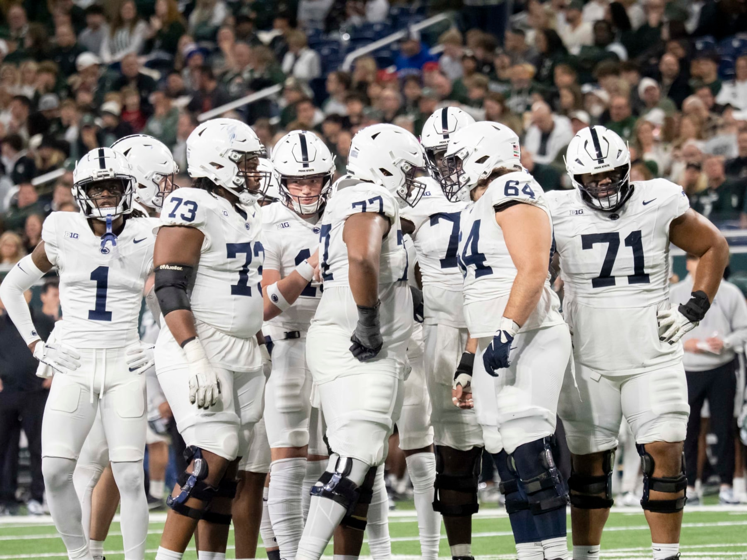 DETROIT, MI - NOVEMBER 24: The Penn State Nittany Lions huddle during a college football game between the Penn State Nittany Lions and the Michigan State Spartans on November 24, 2023 at Ford Field in Detroit, Michigan. (Photo by Joseph Weiser/Icon Sportswire via Getty Images)