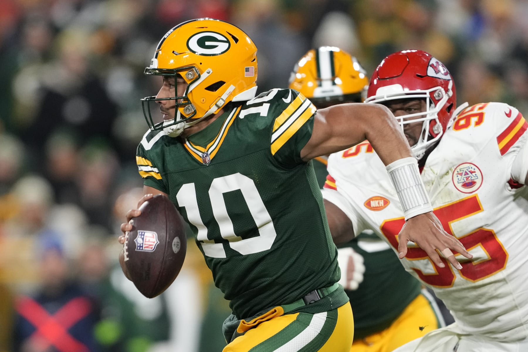 GREEN BAY, WISCONSIN - DECEMBER 03: Jordan Love #10 of the Green Bay Packers runs with the ball during the second half against the Kansas City Chiefs at Lambeau Field on December 03, 2023 in Green Bay, Wisconsin. (Photo by Patrick McDermott/Getty Images)