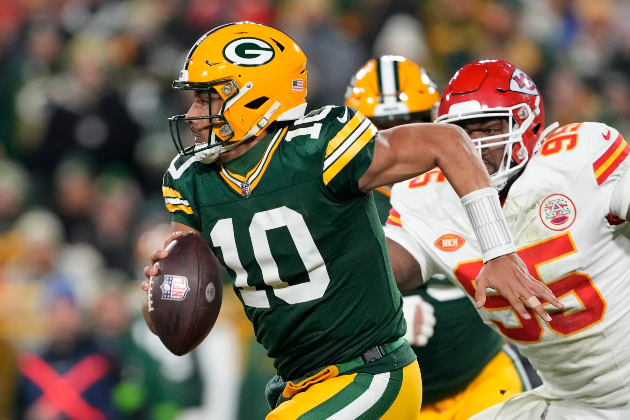 GREEN BAY, WISCONSIN - DECEMBER 03: Jordan Love #10 of the Green Bay Packers runs with the ball during the second half against the Kansas City Chiefs at Lambeau Field on December 03, 2023 in Green Bay, Wisconsin. (Photo by Patrick McDermott/Getty Images)