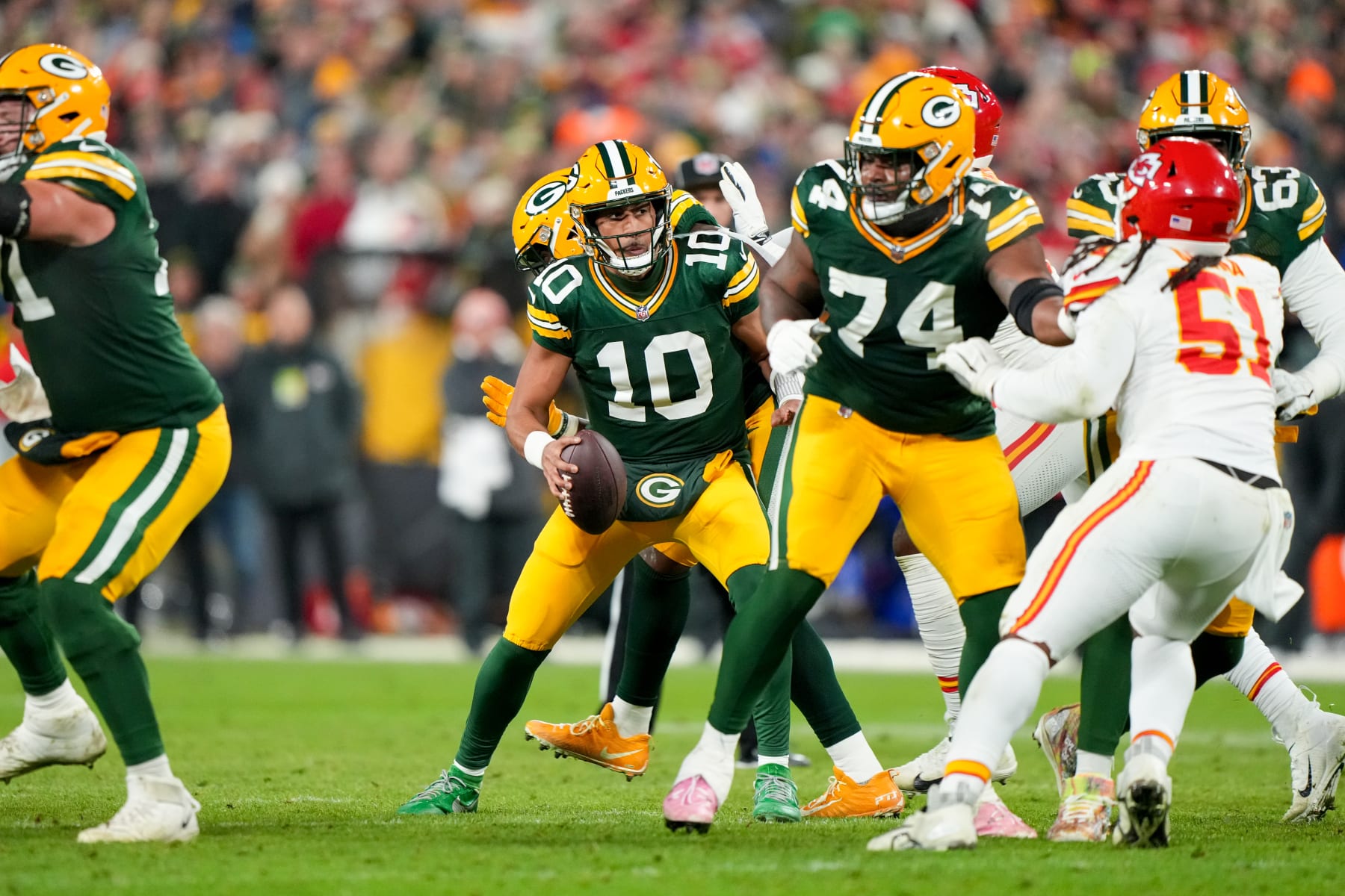 GREEN BAY, WI - DECEMBER 3: Quarterback Jordan Love #10 of the Green Bay Packers sets up for a pass during an NFL football game against the Kansas City Chiefs at Lambeau Field on December 3, 2023 in Green Bay, Wisconsin. (Photo by Todd Rosenberg/Getty Images)