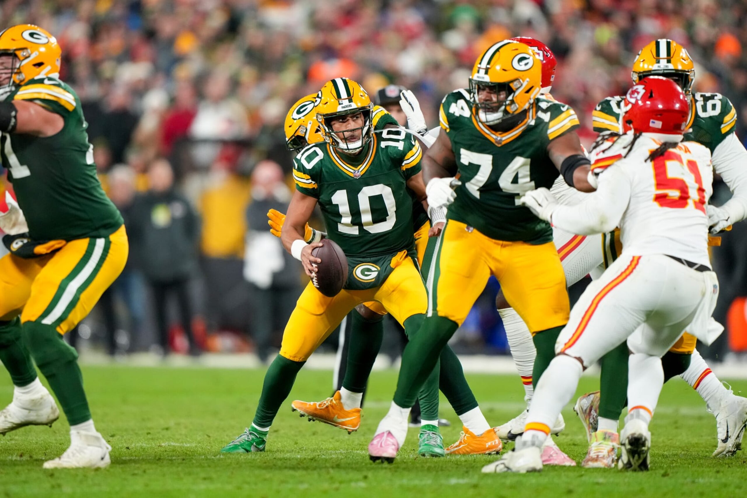 GREEN BAY, WI - DECEMBER 3: Quarterback Jordan Love #10 of the Green Bay Packers sets up for a pass during an NFL football game against the Kansas City Chiefs at Lambeau Field on December 3, 2023 in Green Bay, Wisconsin. (Photo by Todd Rosenberg/Getty Images)