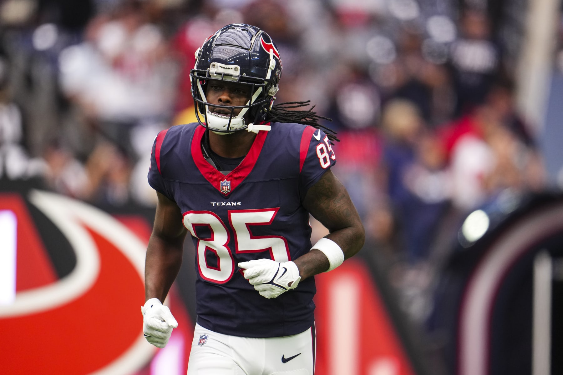 HOUSTON, TX - OCTOBER 15: Noah Brown #85 of the Houston Texans runs out of the tunnel prior to an NFL football game against the New Orleans Saints at NRG Stadium on October 15, 2023 in Houston, Texas. (Photo by Cooper Neill/Getty Images)