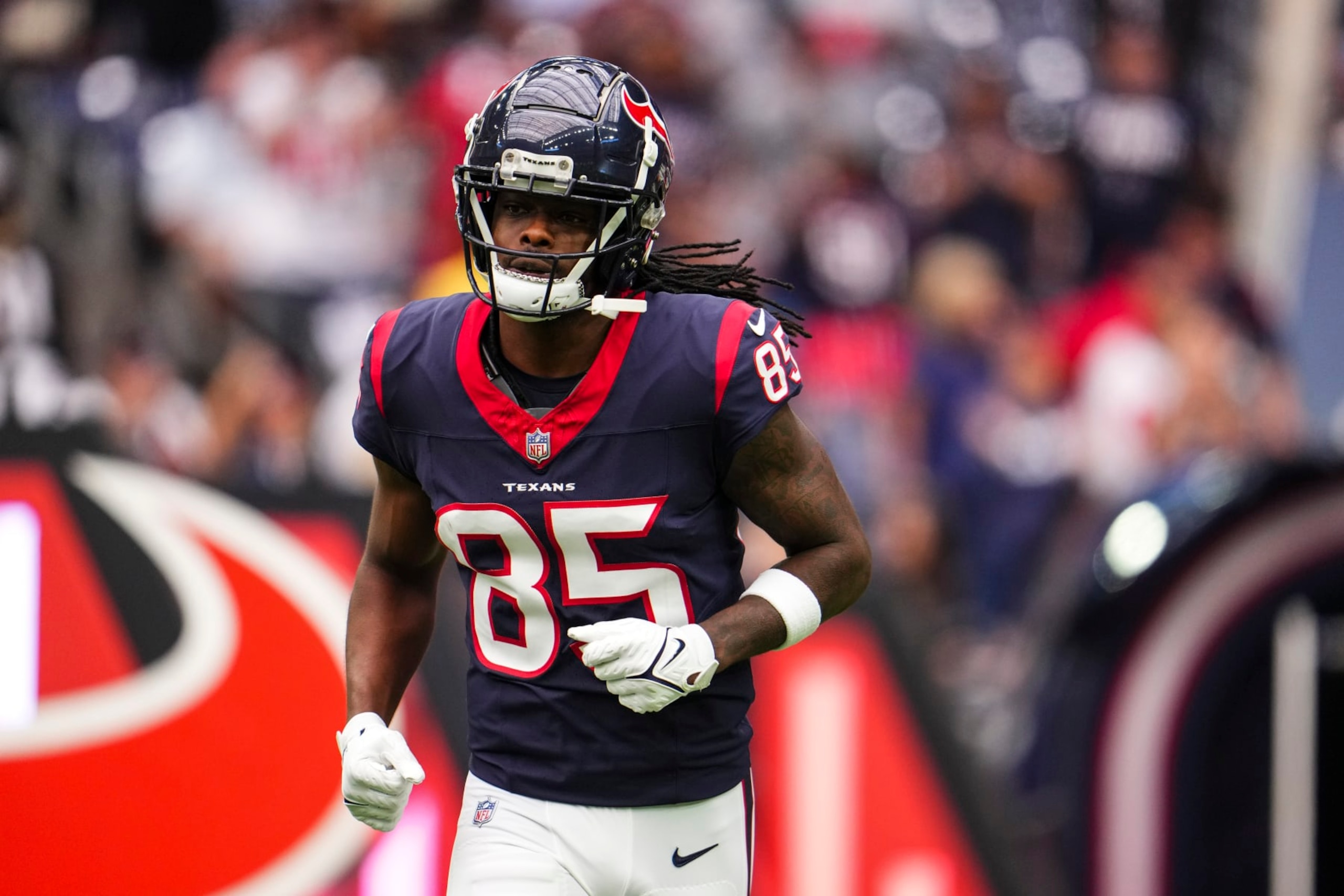HOUSTON, TX - OCTOBER 15: Noah Brown #85 of the Houston Texans runs out of the tunnel prior to an NFL football game against the New Orleans Saints at NRG Stadium on October 15, 2023 in Houston, Texas. (Photo by Cooper Neill/Getty Images)