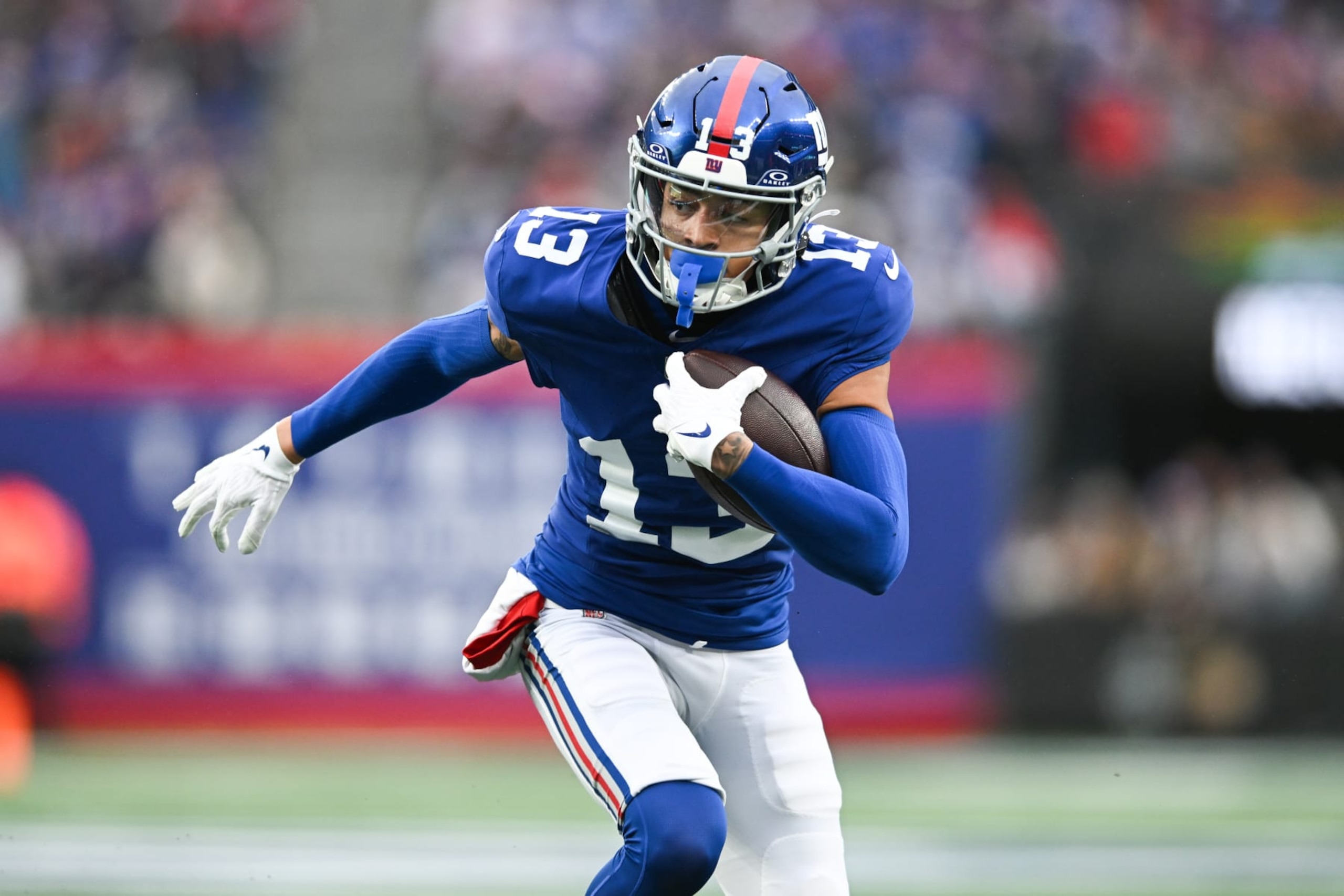 EAST RUTHERFORD, NJ - NOVEMBER 26: Jalin Hyatt #13 of the New York Giants runs with the football during the first half against the New England Patriots at MetLife Stadium on November 26, 2023 in East Rutherford, New Jersey. (Photo by Kathryn Riley/Getty Images)