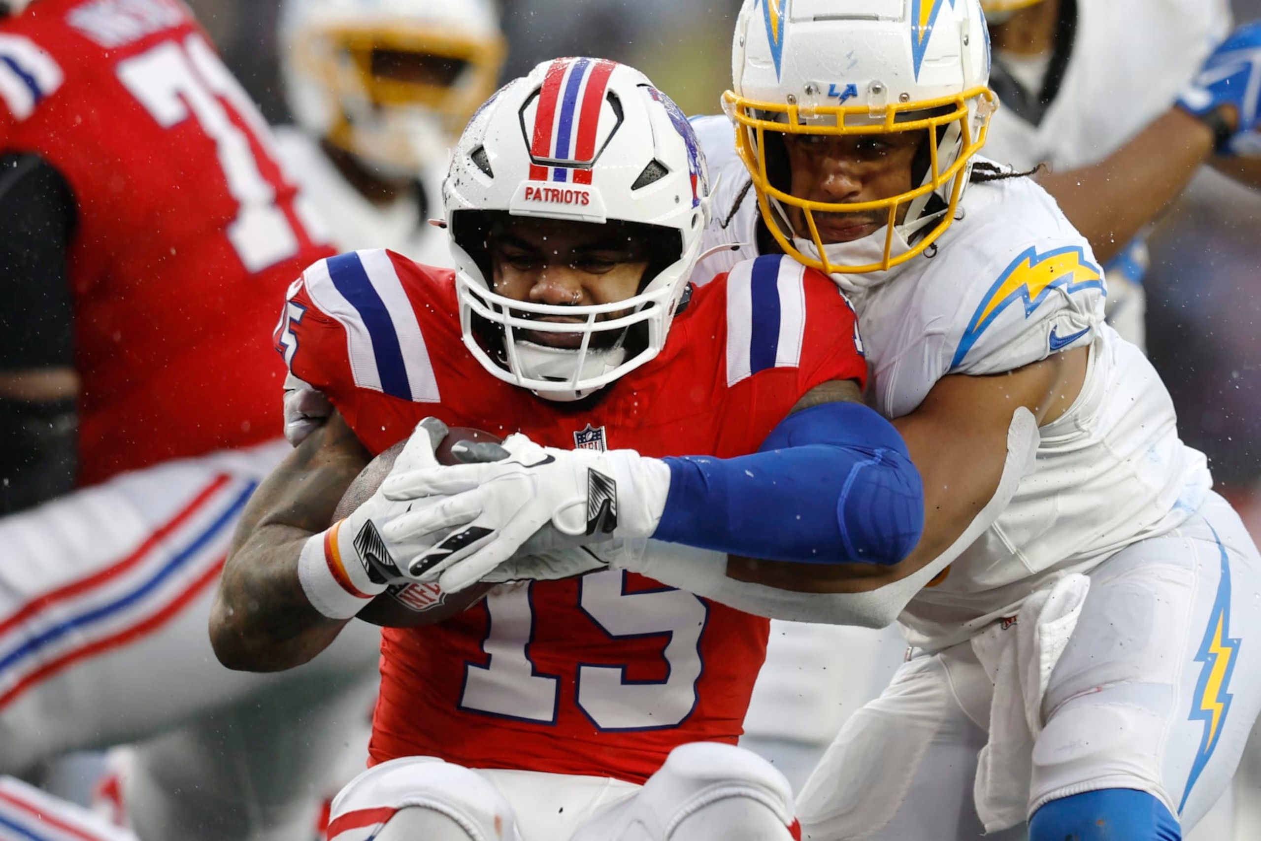 New England Patriots running back Ezekiel Elliott (15) during the first half of an NFL football game, Sunday, Dec. 3, 2023, in Foxborough, Mass. (AP Photo/Michael Dwyer)