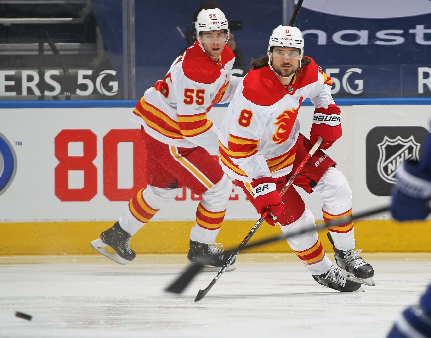 Calgary Flames defensemen Chris Tanev (left) and Noah Hanifin. 