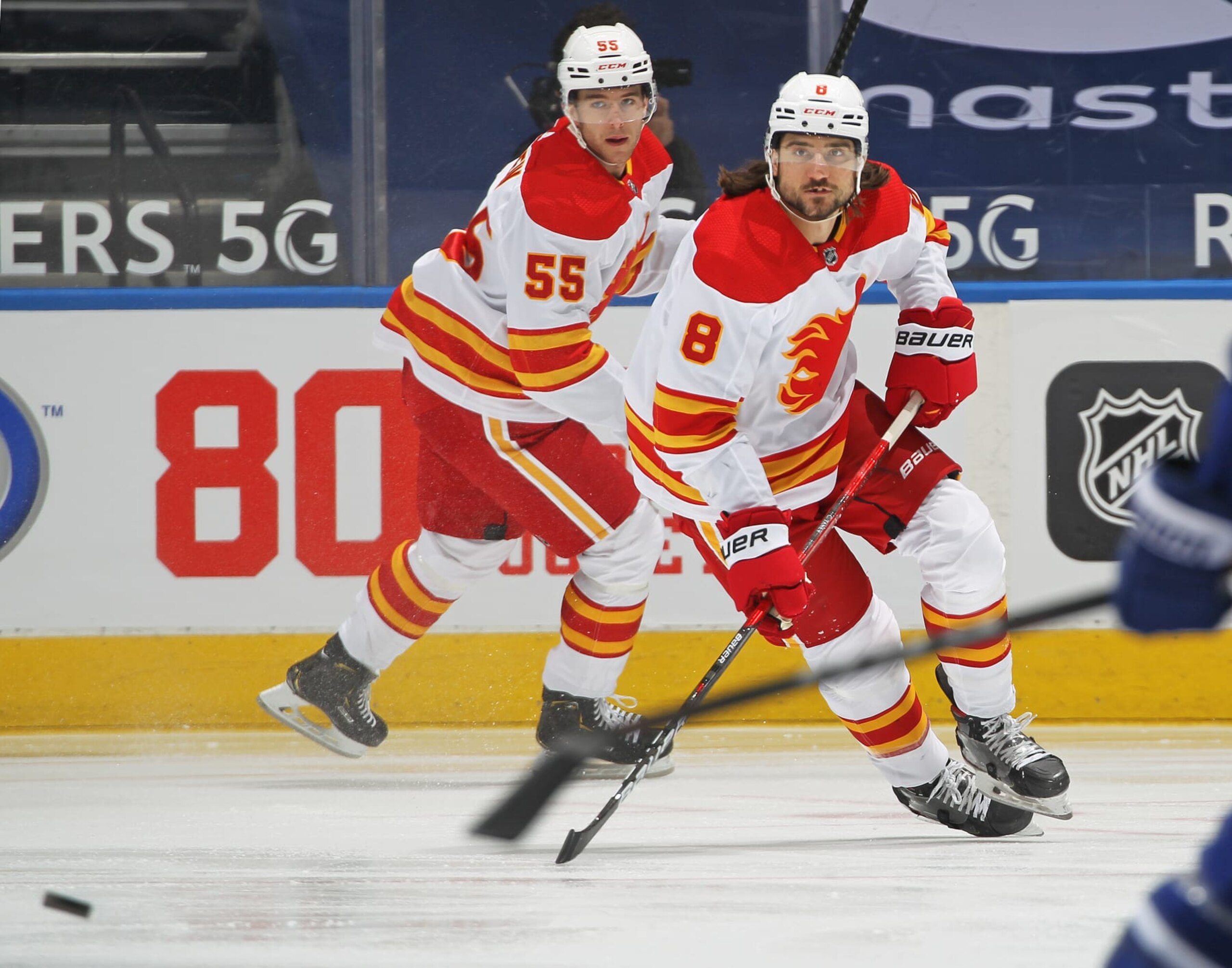 Calgary Flames defensemen Chris Tanev (left) and Noah Hanifin. Calgary Flames defensemen Chris Tanev (left) and Noah Hanifin.