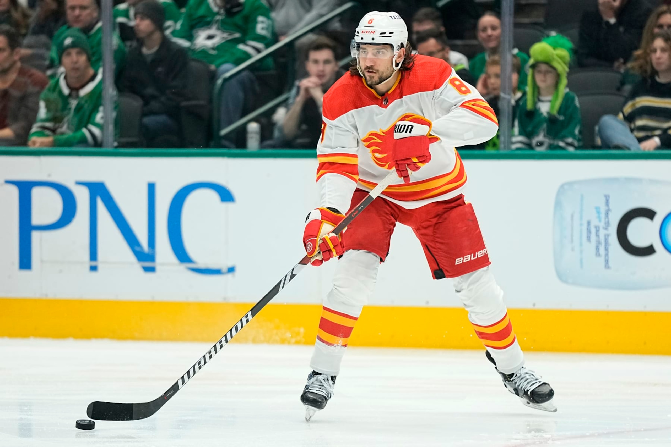 DALLAS, TEXAS - NOVEMBER 24: Chris Tanev #8 of the Calgary Flames passes the puck during the first period against the Dallas Stars at American Airlines Center on November 24, 2023 in Dallas, Texas. (Photo by Sam Hodde/Getty Images) DALLAS, TEXAS - NOVEMBER 24: Chris Tanev #8 of the Calgary Flames passes the puck during the first period against the Dallas Stars at American Airlines Center on November 24, 2023 in Dallas, Texas. (Photo by Sam Hodde/Getty Images)