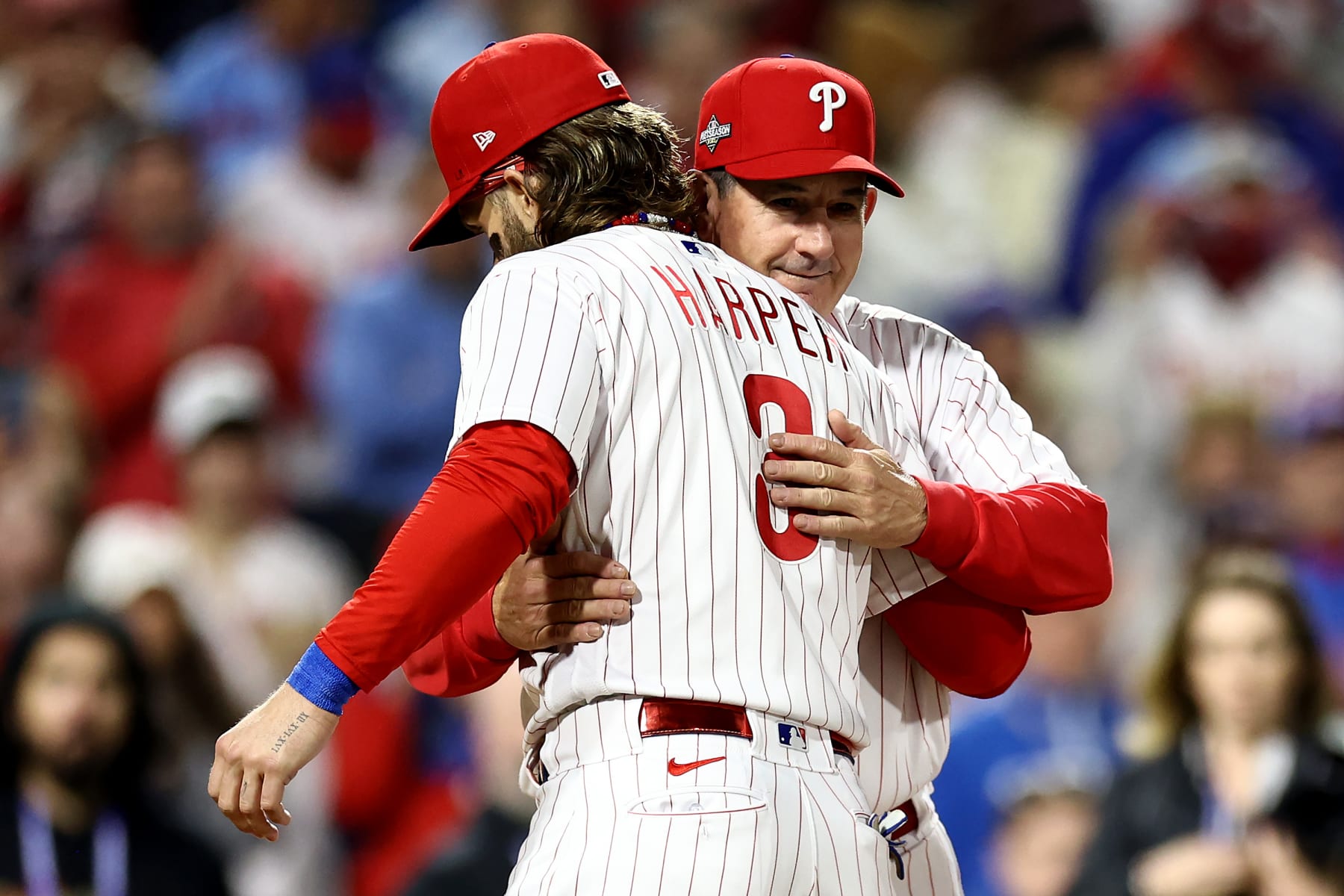 PHILADELPHIA, PENNSYLVANIA - OCTOBER 16: Manager Rob Thomson #59 greets Bryce Harper #3 of the Philadelphia Phillies before the start of Game One of the Championship Series against the Arizona Diamondbacks at Citizens Bank Park on October 16, 2023 in Philadelphia, Pennsylvania. (Photo by Tim Nwachukwu/Getty Images)