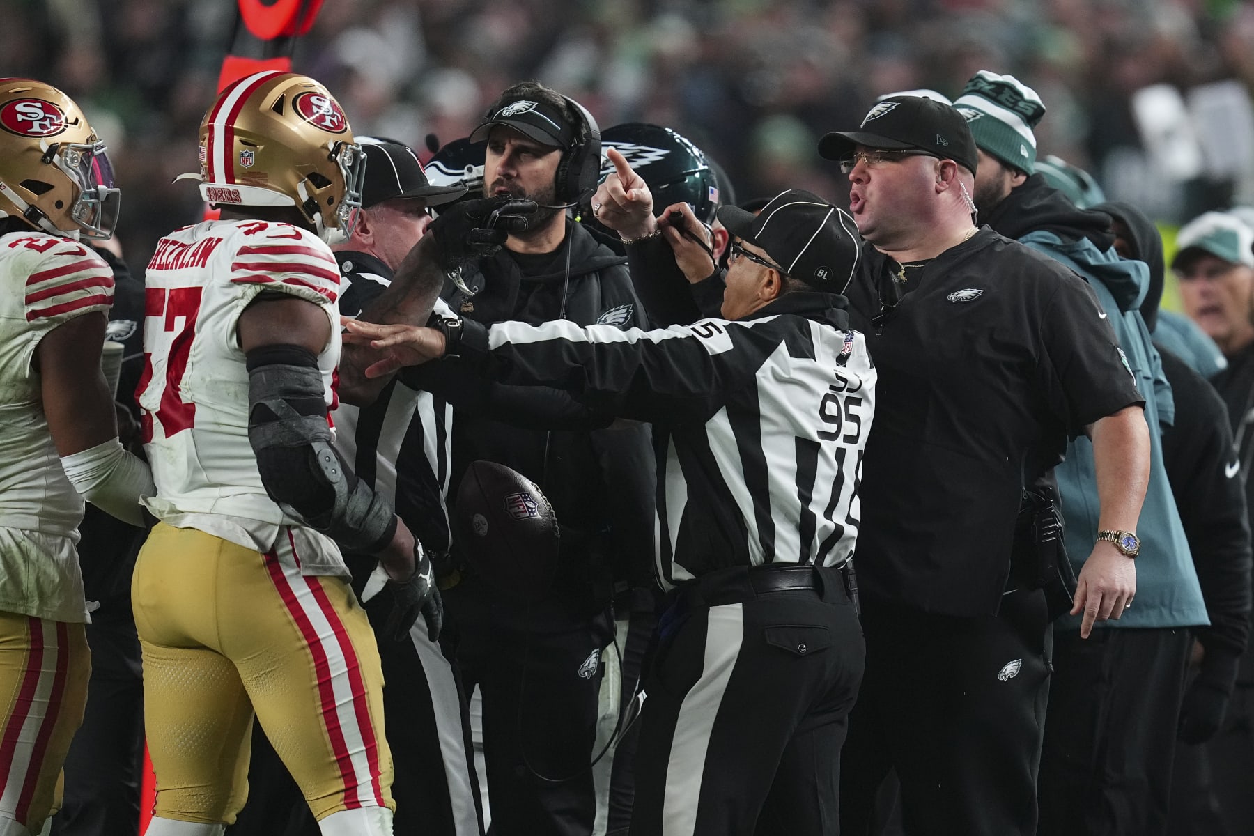 PHILADELPHIA, PENNSYLVANIA - DECEMBER 3: Dre Greenlaw #57 of the San Francisco 49ers gets into an altercation with head of security Dom DiSandro of the Philadelphia Eagles at Lincoln Financial Field on December 3, 2023 in Philadelphia, Pennsylvania. (Photo by Mitchell Leff/Getty Images)
