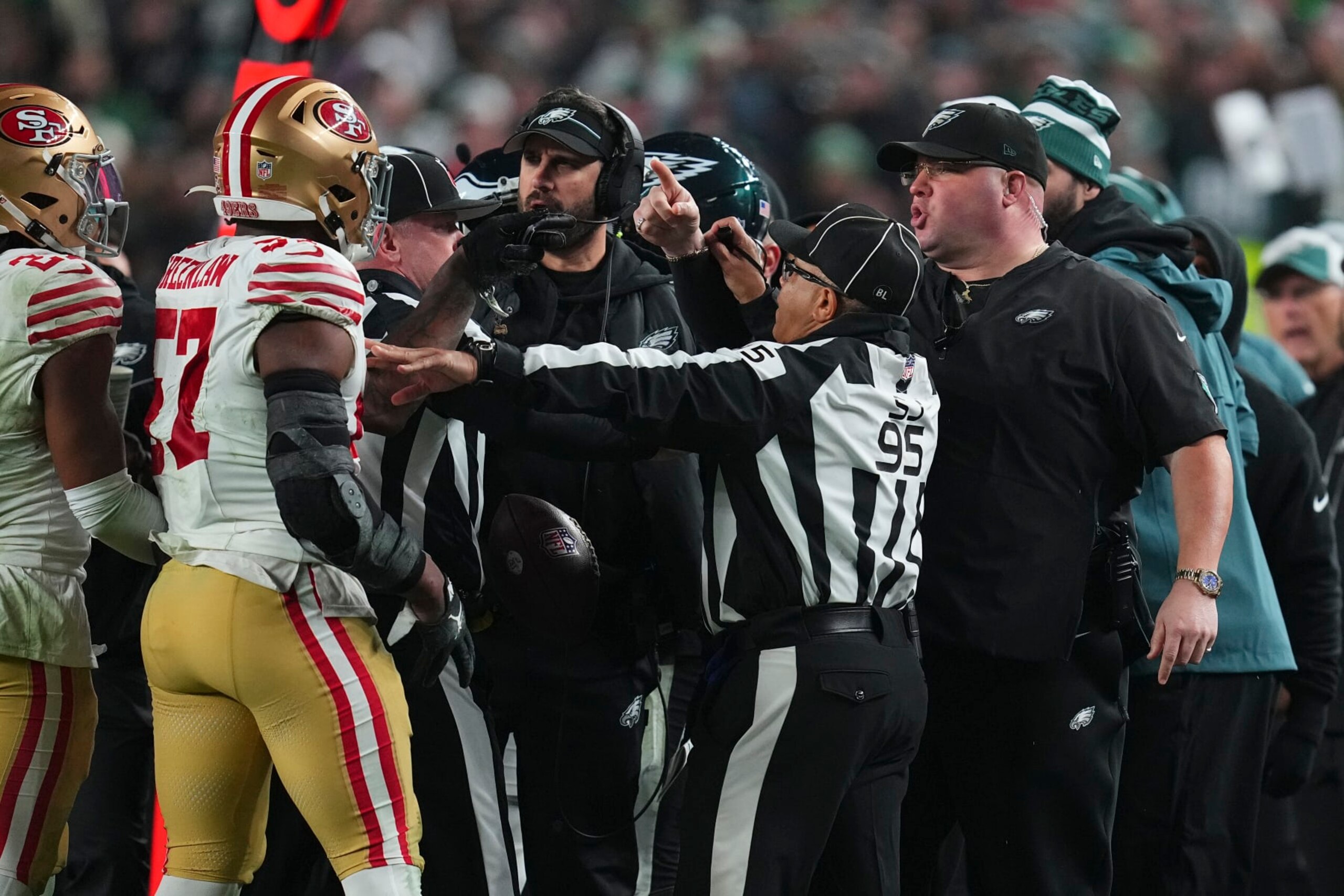PHILADELPHIA, PENNSYLVANIA - DECEMBER 3: Dre Greenlaw #57 of the San Francisco 49ers gets into an altercation with head of security Dom DiSandro of the Philadelphia Eagles at Lincoln Financial Field on December 3, 2023 in Philadelphia, Pennsylvania. (Photo by Mitchell Leff/Getty Images)