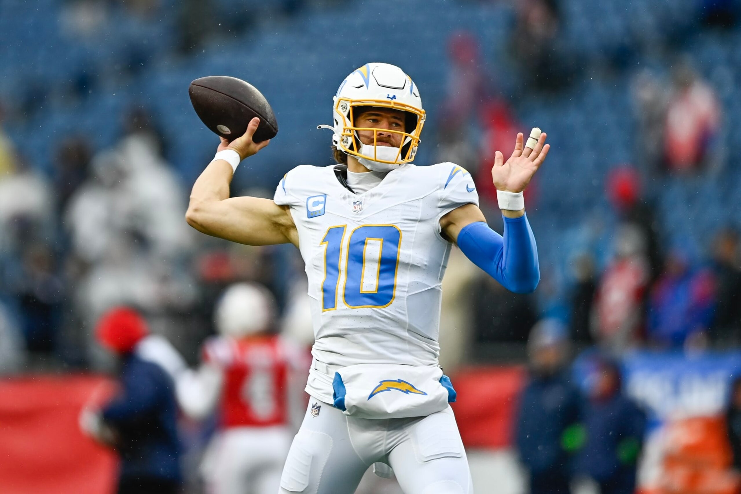 FOXBOROUGH, MASSACHUSETTS - DECEMBER 03: Justin Herbert #10 of the Los Angeles Chargers warms up before the game against the New England Patriots at Gillette Stadium on December 03, 2023 in Foxborough, Massachusetts. (Photo by Billie Weiss/Getty Images) FOXBOROUGH, MASSACHUSETTS - DECEMBER 03: Justin Herbert #10 of the Los Angeles Chargers warms up before the game against the New England Patriots at Gillette Stadium on December 03, 2023 in Foxborough, Massachusetts. (Photo by Billie Weiss/Getty Images)