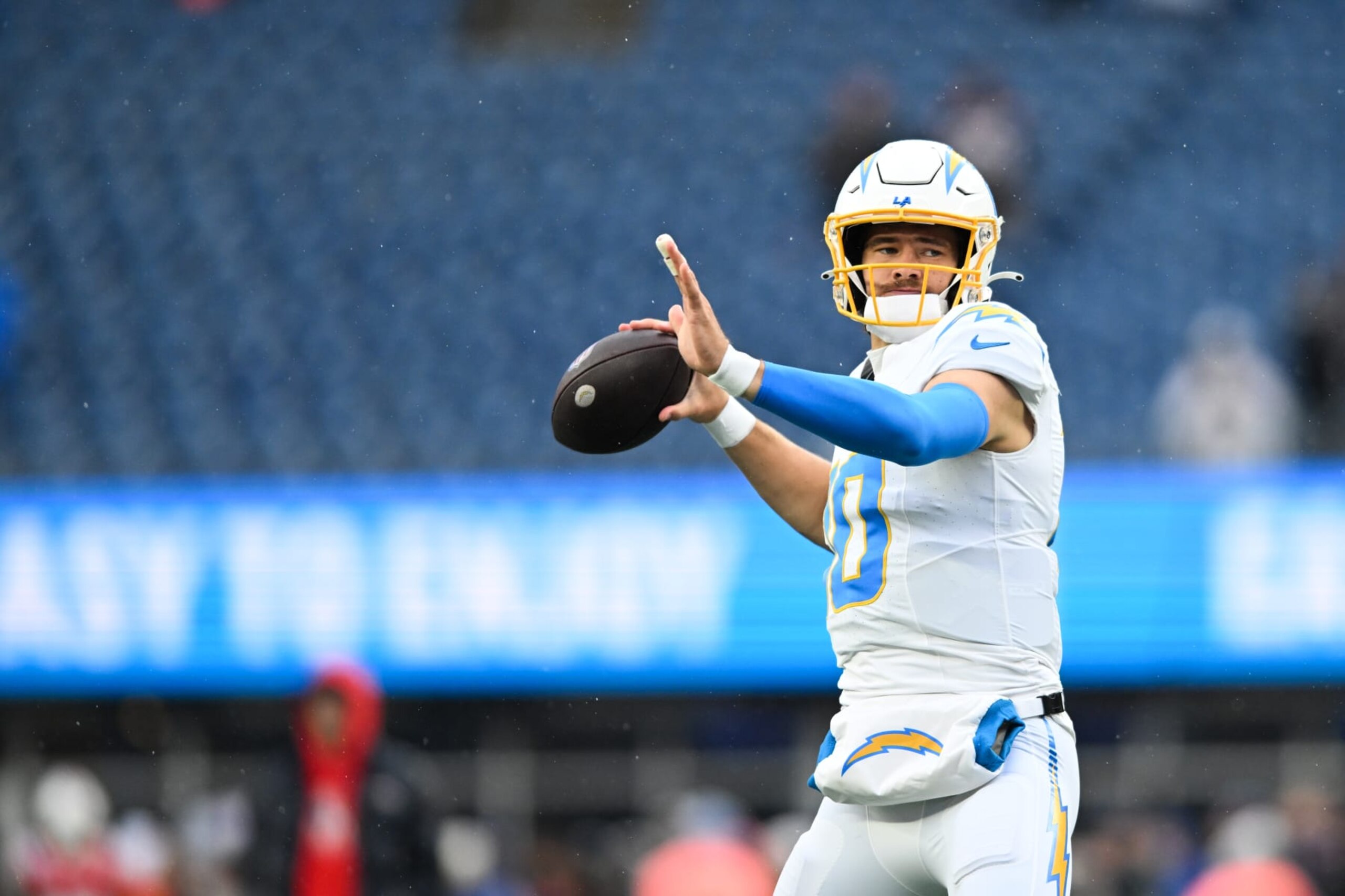 FOXBORO, MA - DECEMBER 3: Justin Herbert #10 of the Los Angeles Chargers throws the football prior to the start of the game against the New England Patriots at Gillette Stadium on December 3, 2023 in Foxboro, Massachusetts. (Photo by Kathryn Riley/Getty Images) FOXBORO, MA - DECEMBER 3: Justin Herbert #10 of the Los Angeles Chargers throws the football prior to the start of the game against the New England Patriots at Gillette Stadium on December 3, 2023 in Foxboro, Massachusetts. (Photo by Kathryn Riley/Getty Images)