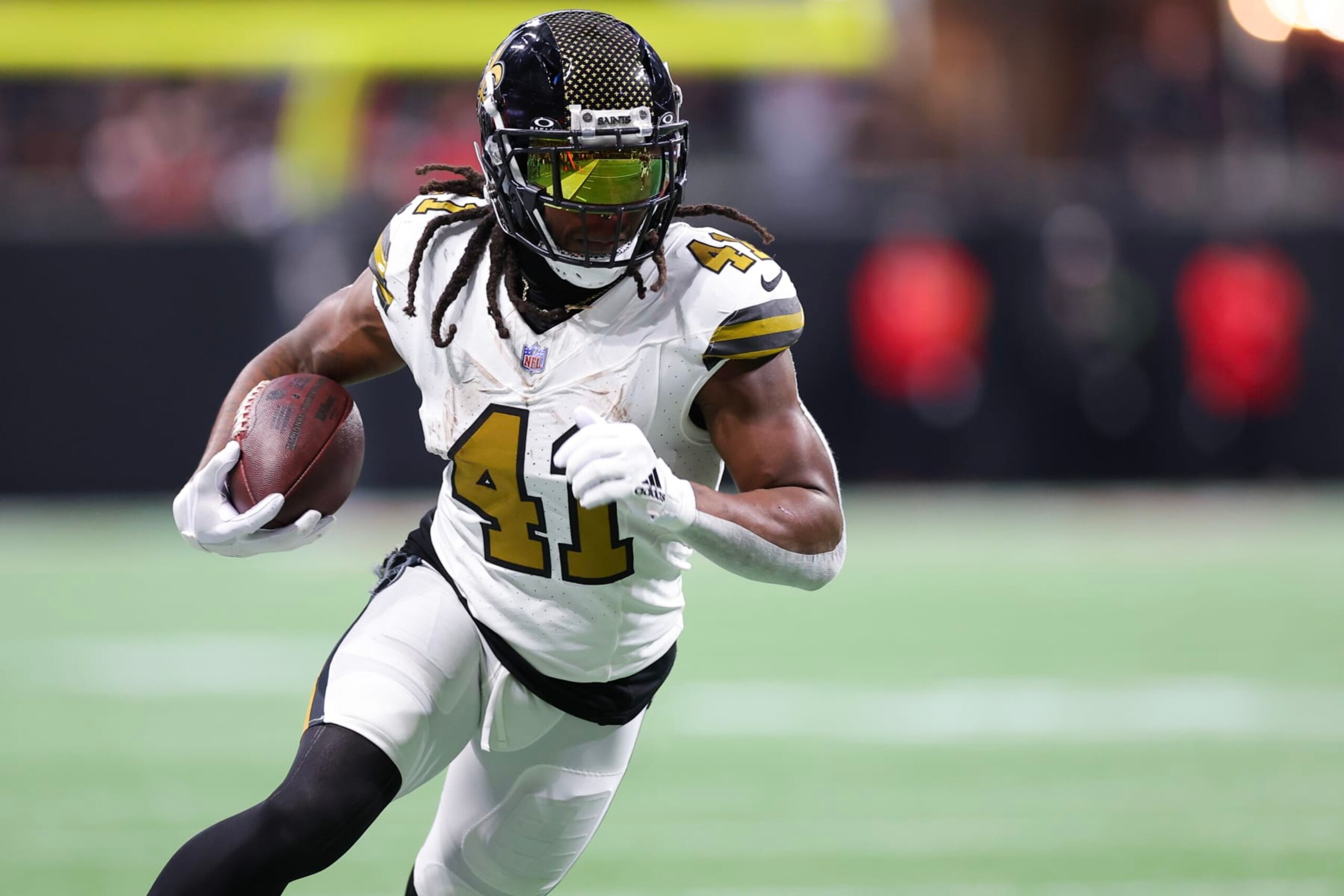 ATLANTA, GEORGIA - NOVEMBER 26: Alvin Kamara #41 of the New Orleans Saints runs with the ball after a reception in the first quarter of the game against the Atlanta Falcons at Mercedes-Benz Stadium on November 26, 2023 in Atlanta, Georgia. (Photo by Kevin C. Cox/Getty Images)