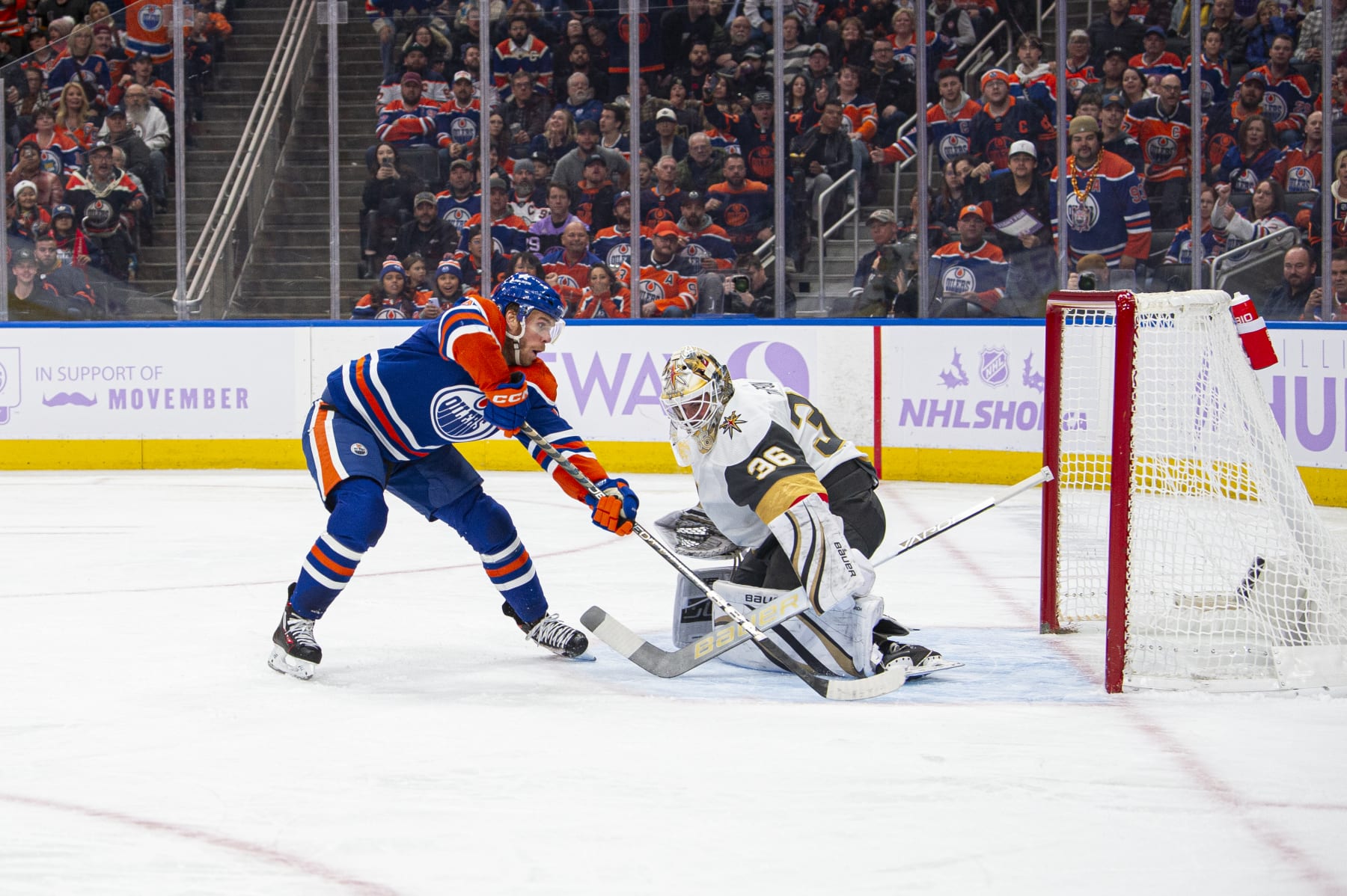 EDMONTON, ALBERTA - NOVEMBER 28: Connor McDavid #97 of the Edmonton Oilers scores on Logan Thompson #36 of the Vegas Golden Knights during the second period at Rogers Place on November 28, 2023 in Edmonton, Alberta, Canada. (Photo by Paul Swanson/NHLI via Getty Images)