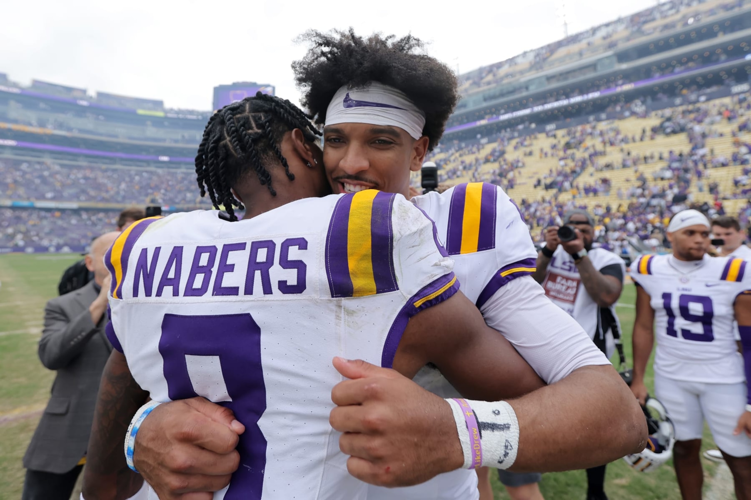 BATON ROUGE, LOUISIANA - NOVEMBER 25: Jayden Daniels #5 and Malik Nabers #8 of the LSU Tigers celebrate after a game against the Texas A&M Aggies at Tiger Stadium on November 25, 2023 in Baton Rouge, Louisiana. (Photo by Jonathan Bachman/Getty Images)