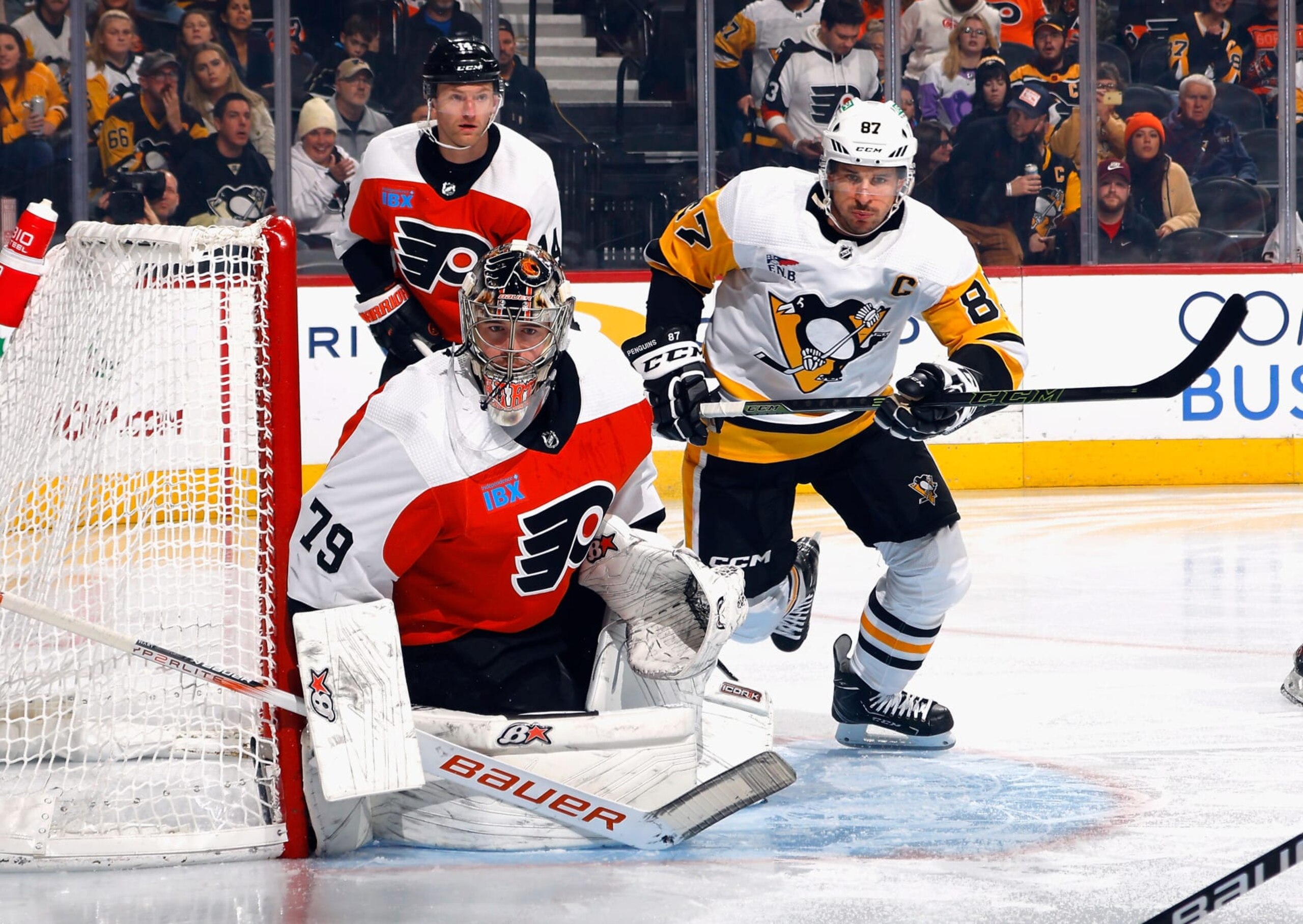 PHILADELPHIA, PENNSYLVANIA - DECEMBER 04: Sidney Crosby #87 of the Pittsburgh Penguins skates against Carter Hart #79 of the Philadelphia Flyers during the first period at the Wells Fargo Center on December 04, 2023 in Philadelphia, Pennsylvania. (Photo by Bruce Bennett/Getty Images)
