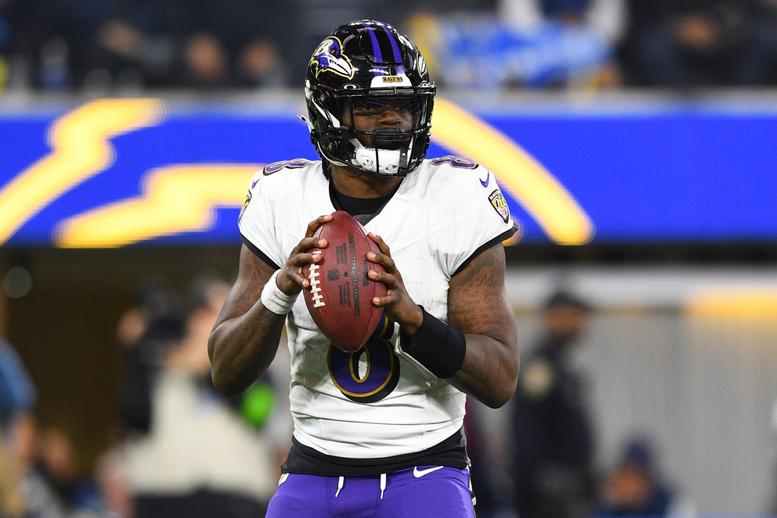 INGLEWOOD, CA - NOVEMBER 26: Baltimore Ravens quarterback Lamar Jackson (8) drops back to pass during the NFL regular season game between the Baltimore Ravens and the Los Angeles Chargers on November 26, 2023, at SoFi Stadium in Inglewood, CA. (Photo by Brian Rothmuller/Icon Sportswire via Getty Images)