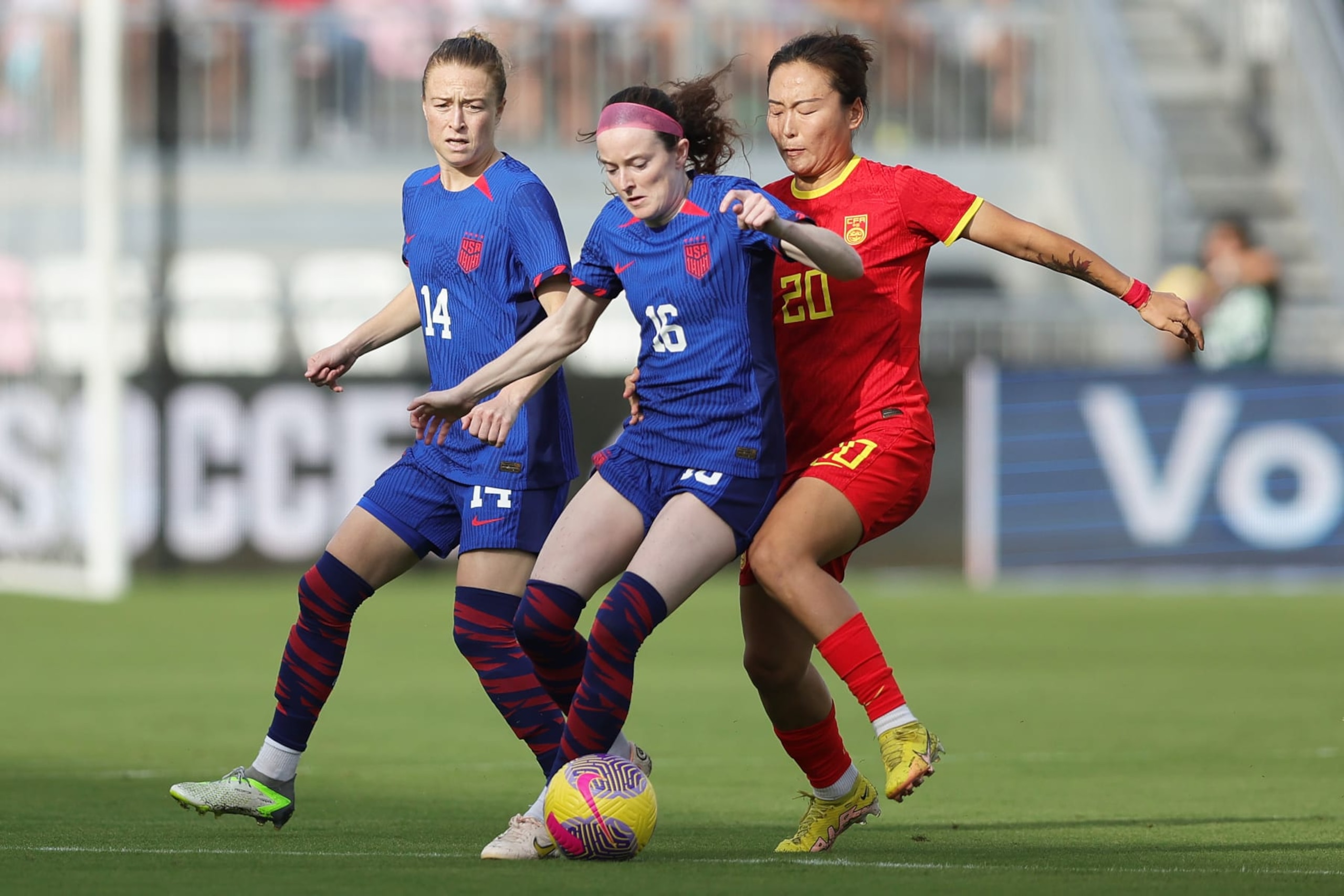 FORT LAUDERDALE, FLORIDA - DECEMBER 02: Rose Lavelle #16 of the United States battles for the ball with Wu Rigumula #20 of China PR during the first half of an international friendly at DRV PNK Stadium on December 02, 2023 in Fort Lauderdale, Florida. (Photo by Megan Briggs/USSF/Getty Images for USSF)