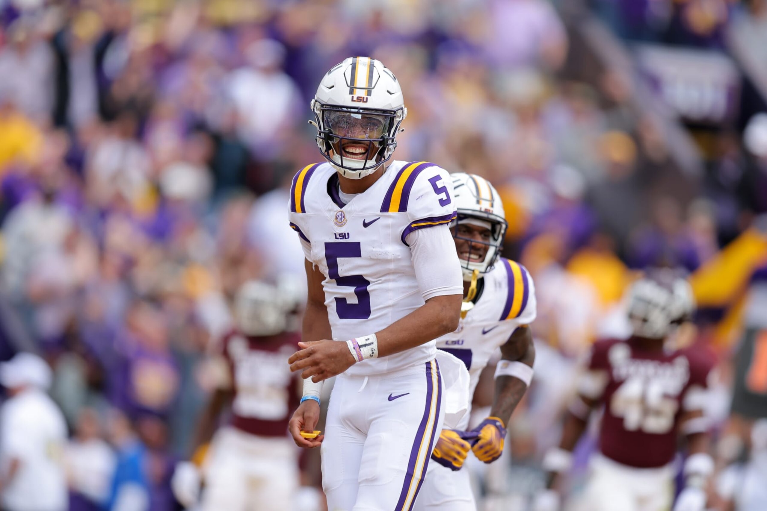 BATON ROUGE, LOUISIANA - NOVEMBER 25: Jayden Daniels #5 of the LSU Tigers celebrates a touchdown during a game against the Texas A&M Aggies at Tiger Stadium on November 25, 2023 in Baton Rouge, Louisiana. (Photo by Jonathan Bachman/Getty Images)
