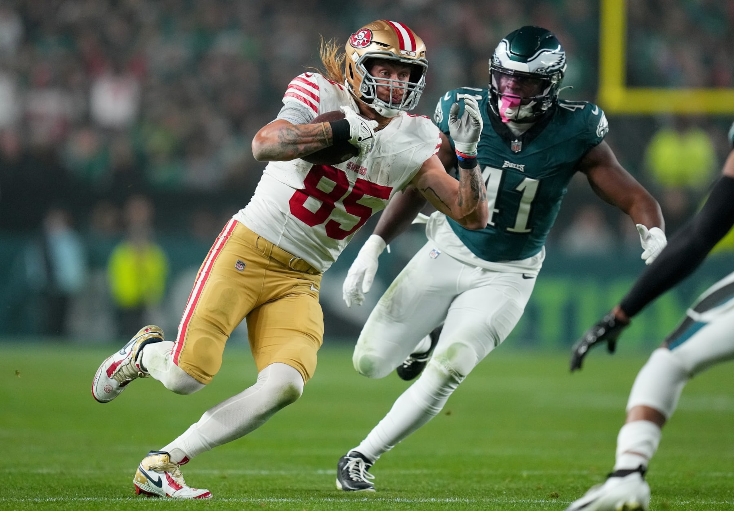 PHILADELPHIA, PENNSYLVANIA - DECEMBER 03: George Kittle #85 of the San Francisco 49ers runs the ball while chased by Nicholas Morrow #41 of the Philadelphia Eagles during the second quarter at Lincoln Financial Field on December 03, 2023 in Philadelphia, Pennsylvania. (Photo by Mitchell Leff/Getty Images)