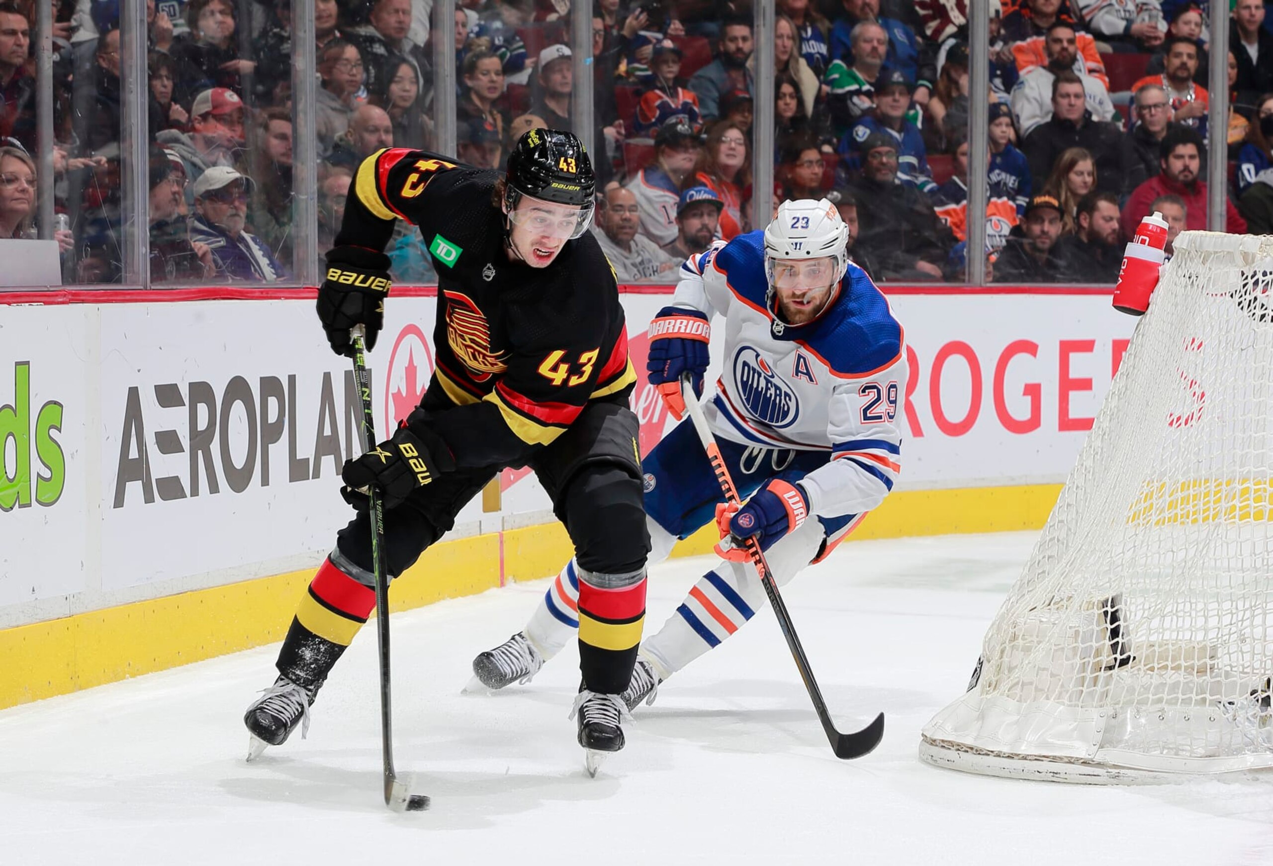 Vancouver Canucks defenseman Quinn Hughes (left) and Edmonton Oilers forward Leon Draisaitl Vancouver Canucks defenseman Quinn Hughes (left) and Edmonton Oilers forward Leon Draisaitl