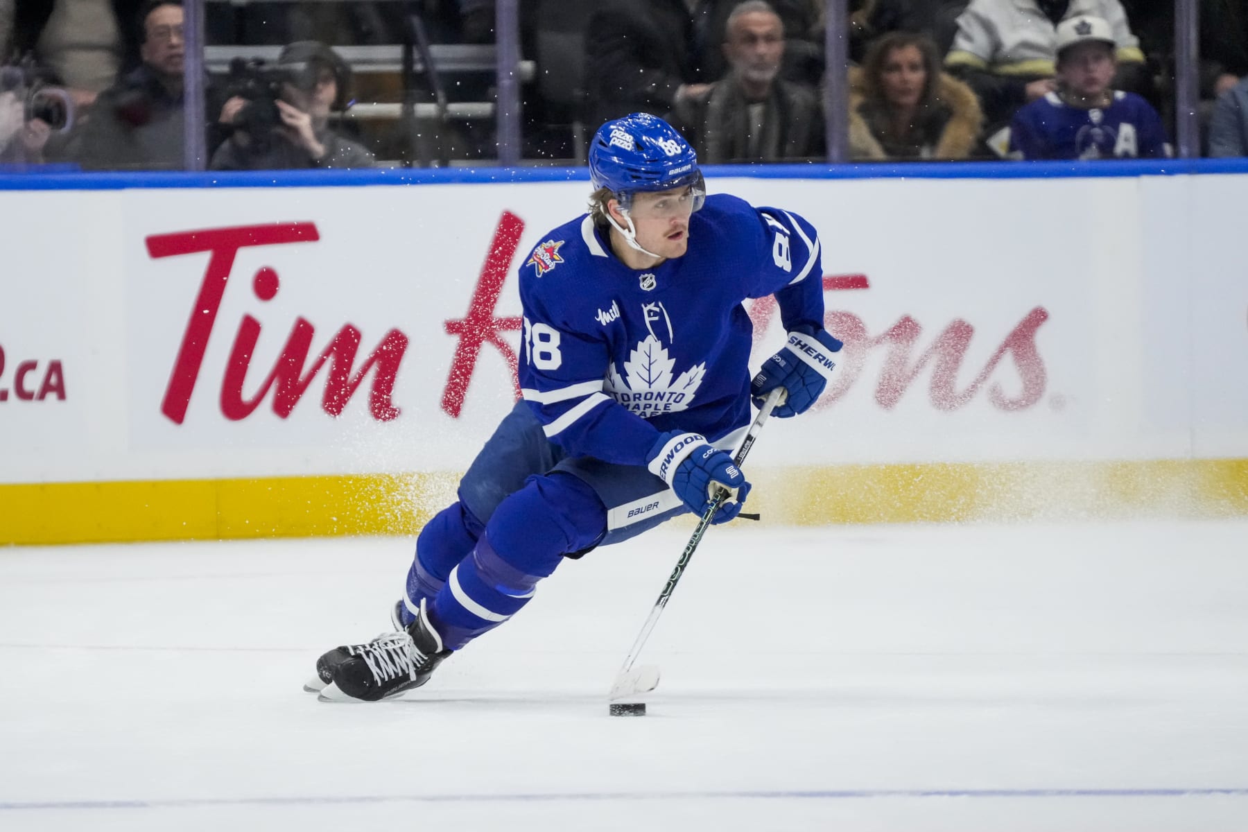 TORONTO, ON - DECEMBER 2: William Nylander #88 of the Toronto Maple Leafs plays the puck against the Boston Bruins during the first period at the Scotiabank Arena on December 2, 2023 in Toronto, Ontario, Canada. (Photo by Andrew Lahodynskyj/NHLI via Getty Images)