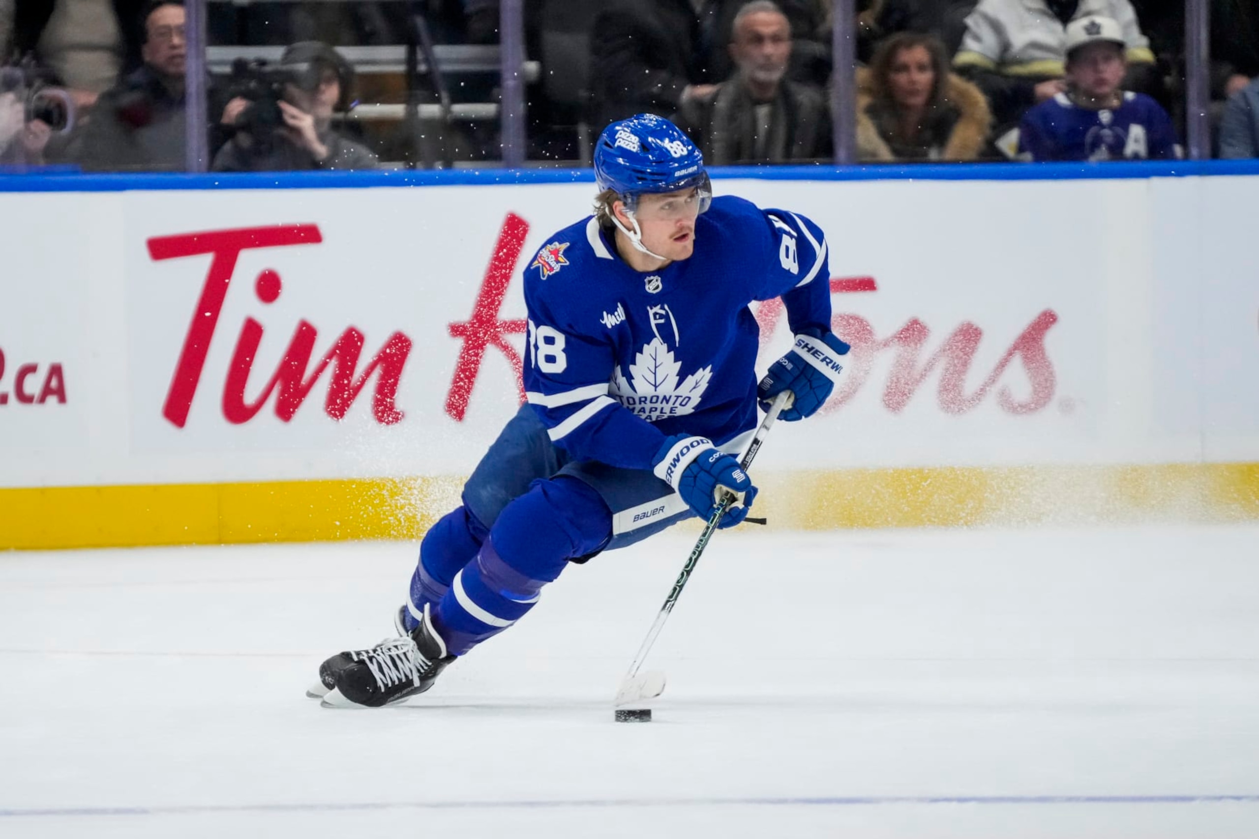 TORONTO, ON - DECEMBER 2: William Nylander #88 of the Toronto Maple Leafs plays the puck against the Boston Bruins during the first period at the Scotiabank Arena on December 2, 2023 in Toronto, Ontario, Canada. (Photo by Andrew Lahodynskyj/NHLI via Getty Images) TORONTO, ON - DECEMBER 2: William Nylander #88 of the Toronto Maple Leafs plays the puck against the Boston Bruins during the first period at the Scotiabank Arena on December 2, 2023 in Toronto, Ontario, Canada. (Photo by Andrew Lahodynskyj/NHLI via Getty Images)