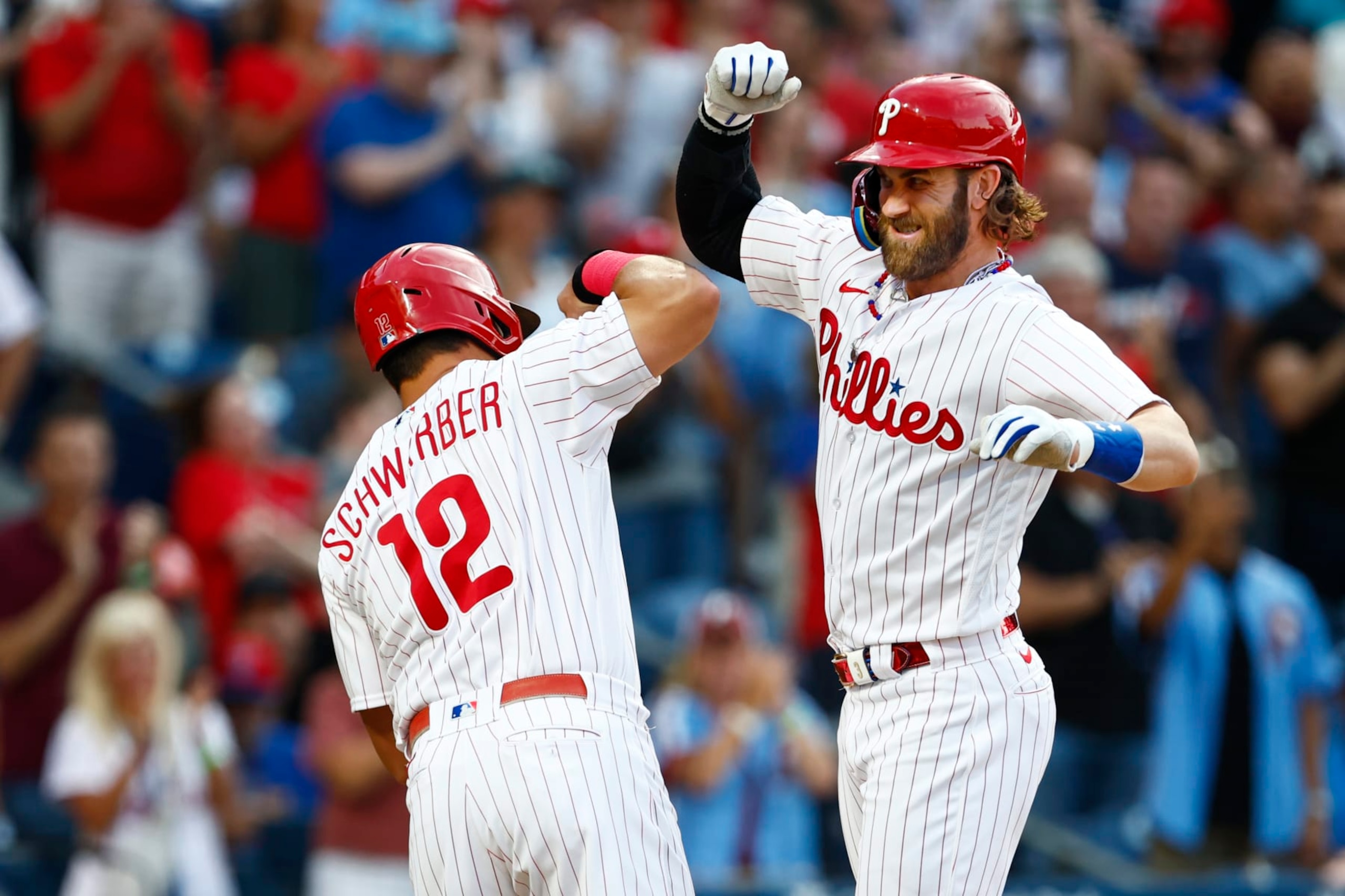 Kyle Schwarber (L) and Bryce Harper (R)