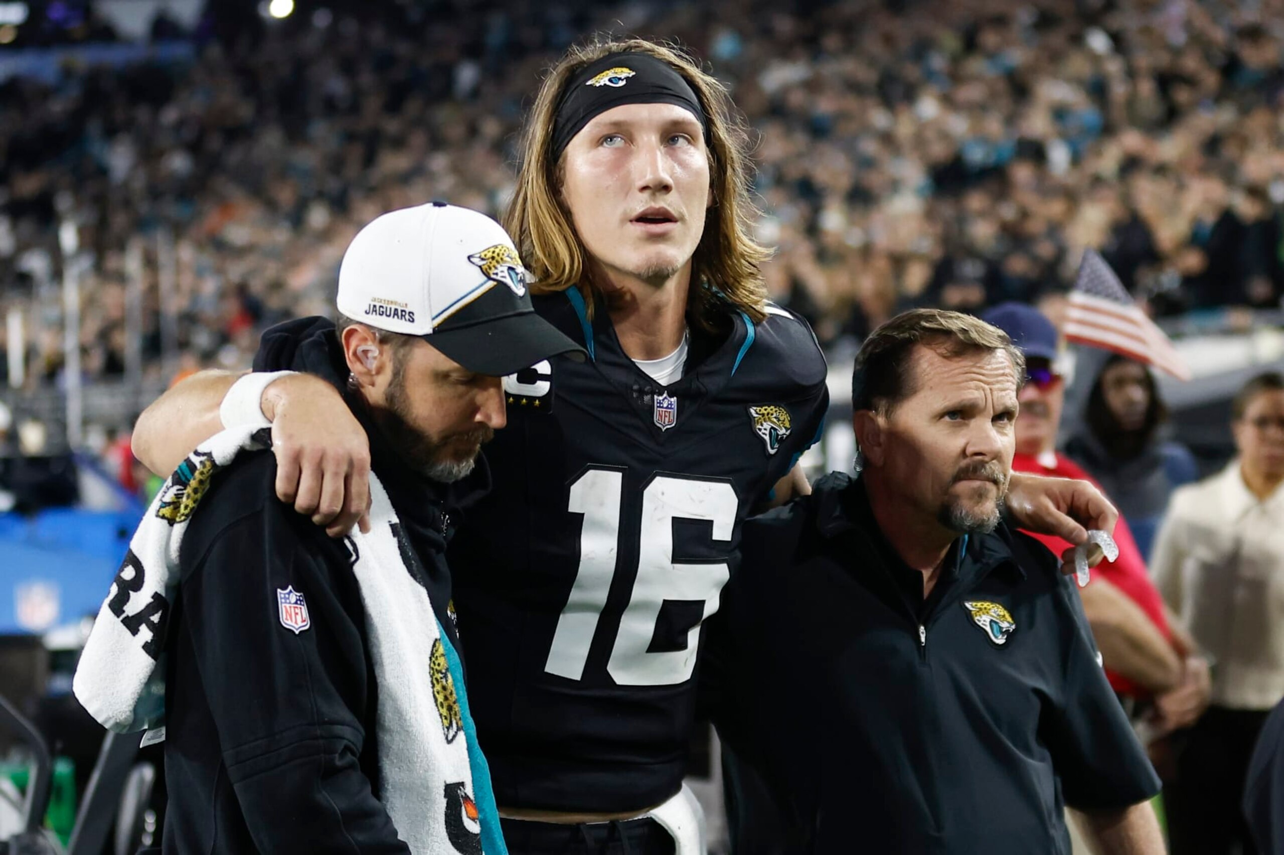JACKSONVILLE, FL - DECEMBER 04: Jacksonville Jaguars quarterback Trevor Lawrence (16) is helped off the field by training staff during the game between the Jacksonville Jaguars and the Cincinnati Bengals on December 4, 2023 at EverBank Stadium in Jacksonville, Fl. (Photo by David Rosenblum/Icon Sportswire via Getty Images) JACKSONVILLE, FL - DECEMBER 04: Jacksonville Jaguars quarterback Trevor Lawrence (16) is helped off the field by training staff during the game between the Jacksonville Jaguars and the Cincinnati Bengals on December 4, 2023 at EverBank Stadium in Jacksonville, Fl. (Photo by David Rosenblum/Icon Sportswire via Getty Images)