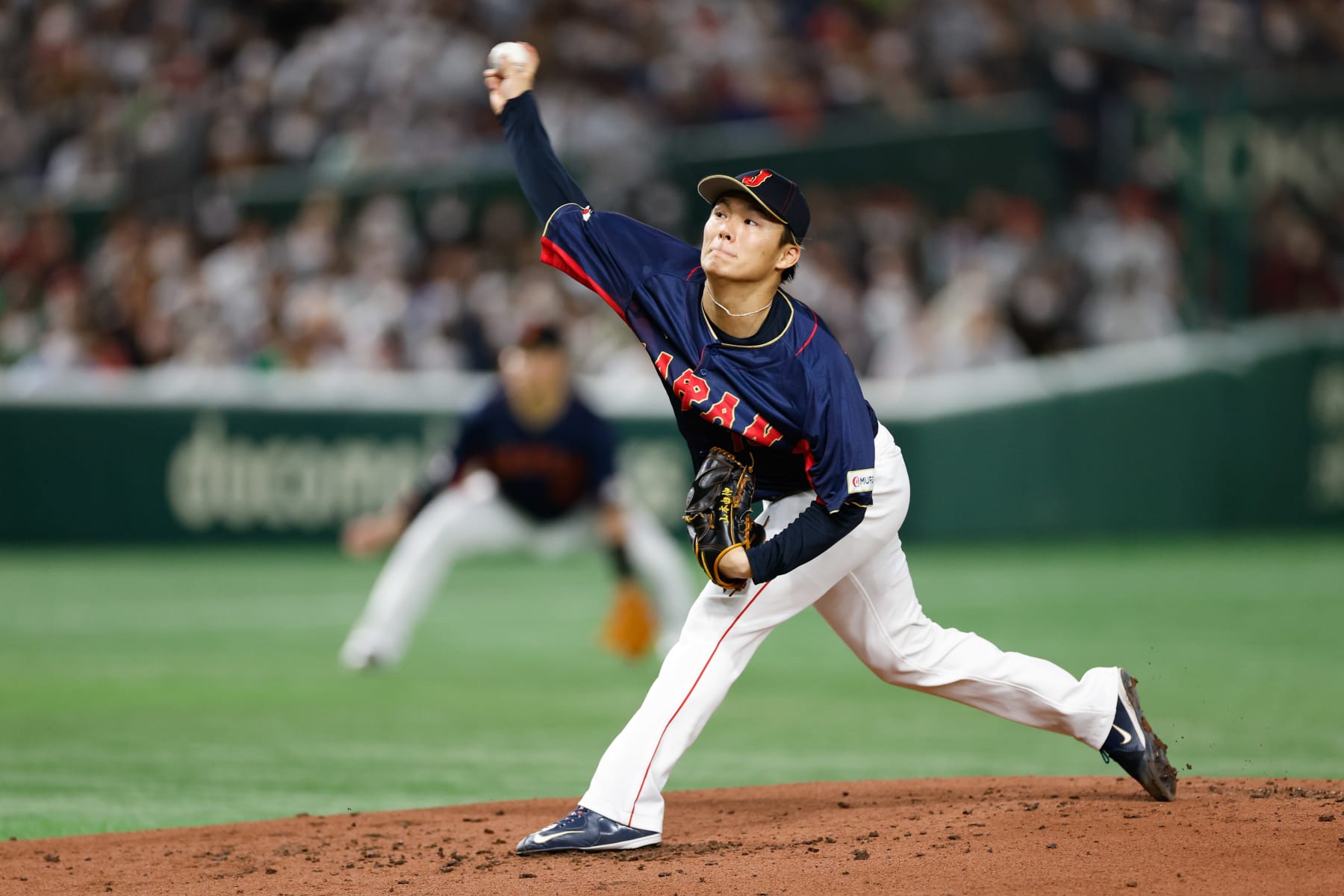 BUNKYO CITY, JAPAN - MARCH 12:   Yoshinobu Yamamoto #18 of Team Japan pitches during Game 8 of Pool B between Team Japan and Team Australia at Tokyo Dome on Sunday, March 12, 2023 in Bunkyo City, Japan. (Photo by Yuki Taguchi/WBCI/MLB Photos via Getty Images)
