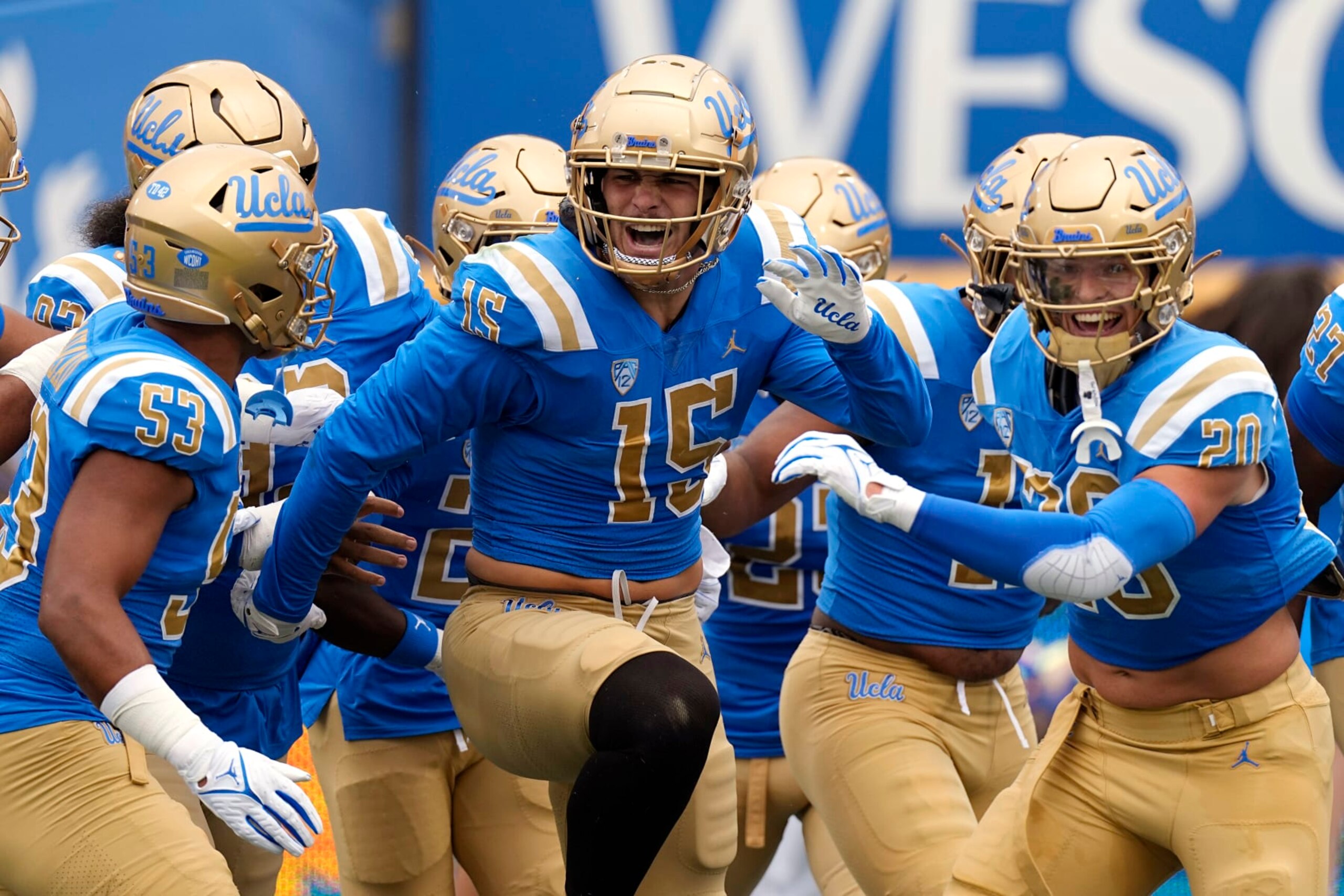 UCLA defensive lineman Laiatu Latu, center, celebrates with teammates after scoring a touchdown on an interception during the first half of an NCAA college football game against North Carolina Central Saturday, Sept. 16, 2023, in Pasadena, Calif. (AP Photo/Mark J. Terrill) UCLA defensive lineman Laiatu Latu, center, celebrates with teammates after scoring a touchdown on an interception during the first half of an NCAA college football game against North Carolina Central Saturday, Sept. 16, 2023, in Pasadena, Calif. (AP Photo/Mark J. Terrill)
