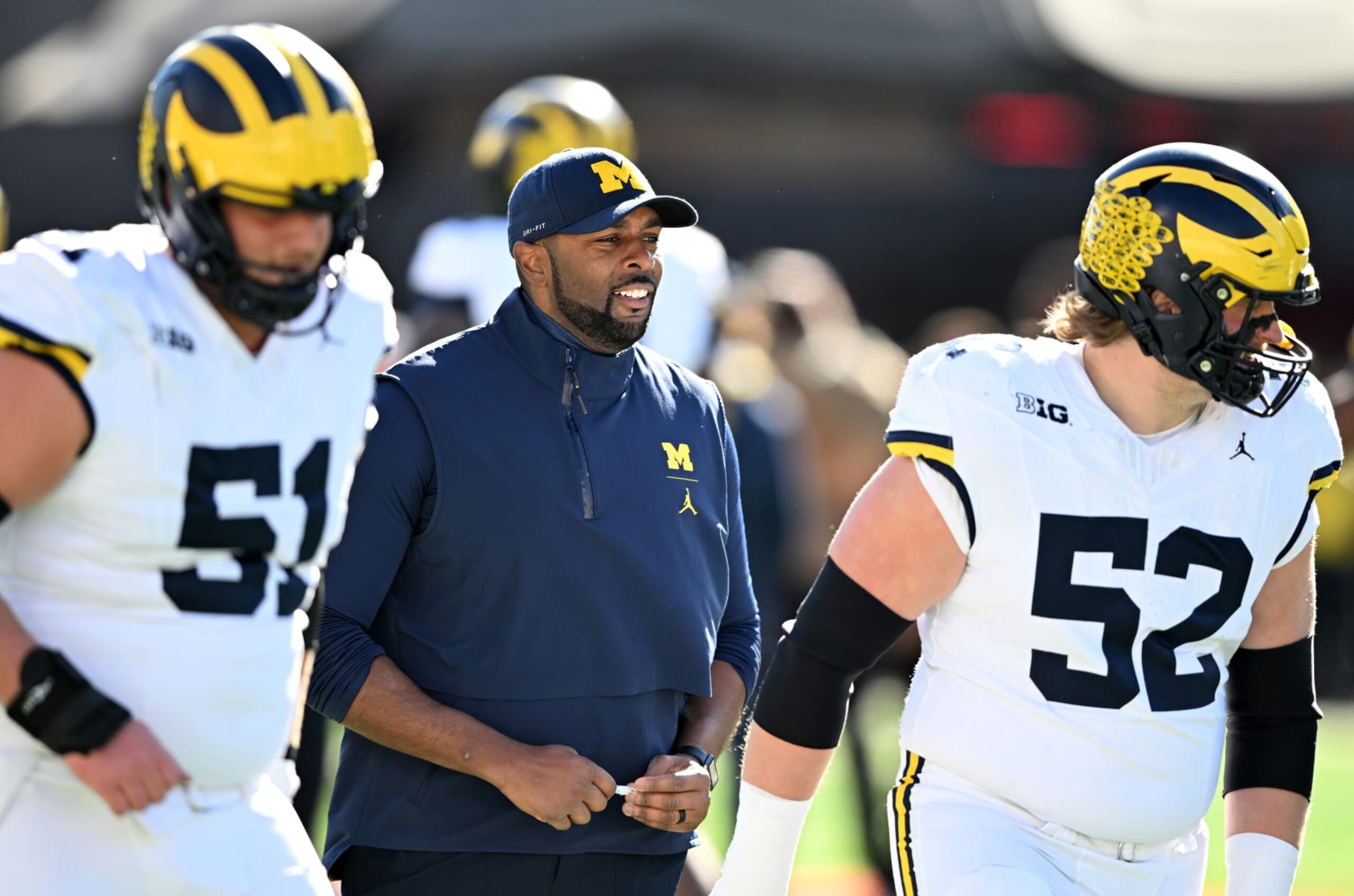 COLLEGE PARK, MARYLAND - NOVEMBER 18: Acting head coach Sherrone Moore of the Michigan Wolverines watches the teams warm up before the game against the Maryland Terrapins at SECU Stadium on November 18, 2023 in College Park, Maryland. (Photo by G Fiume/Getty Images) COLLEGE PARK, MARYLAND - NOVEMBER 18: Acting head coach Sherrone Moore of the Michigan Wolverines watches the teams warm up before the game against the Maryland Terrapins at SECU Stadium on November 18, 2023 in College Park, Maryland. (Photo by G Fiume/Getty Images)