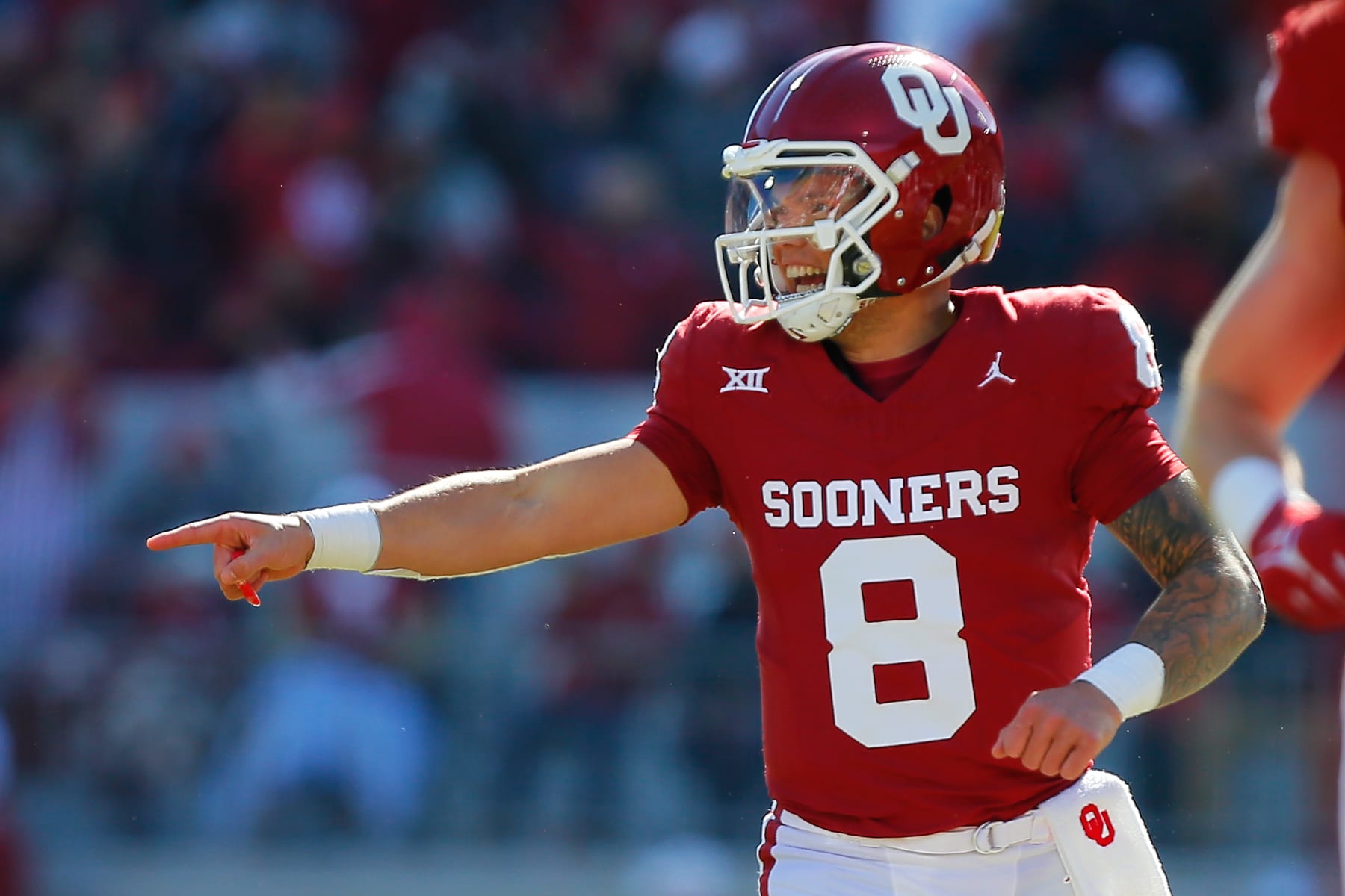 NORMAN, OKLAHOMA - NOVEMBER 24:  Quarterback Dillon Gabriel #8 of the Oklahoma Sooners celebrates after throwing a 53-yard touchdown to wide receiver Brenen Thompson against the TCU Horned Frogs in the second quarter at Gaylord Family Oklahoma Memorial Stadium on November 24, 2023 in Norman, Oklahoma.  (Photo by Brian Bahr/Getty Images)