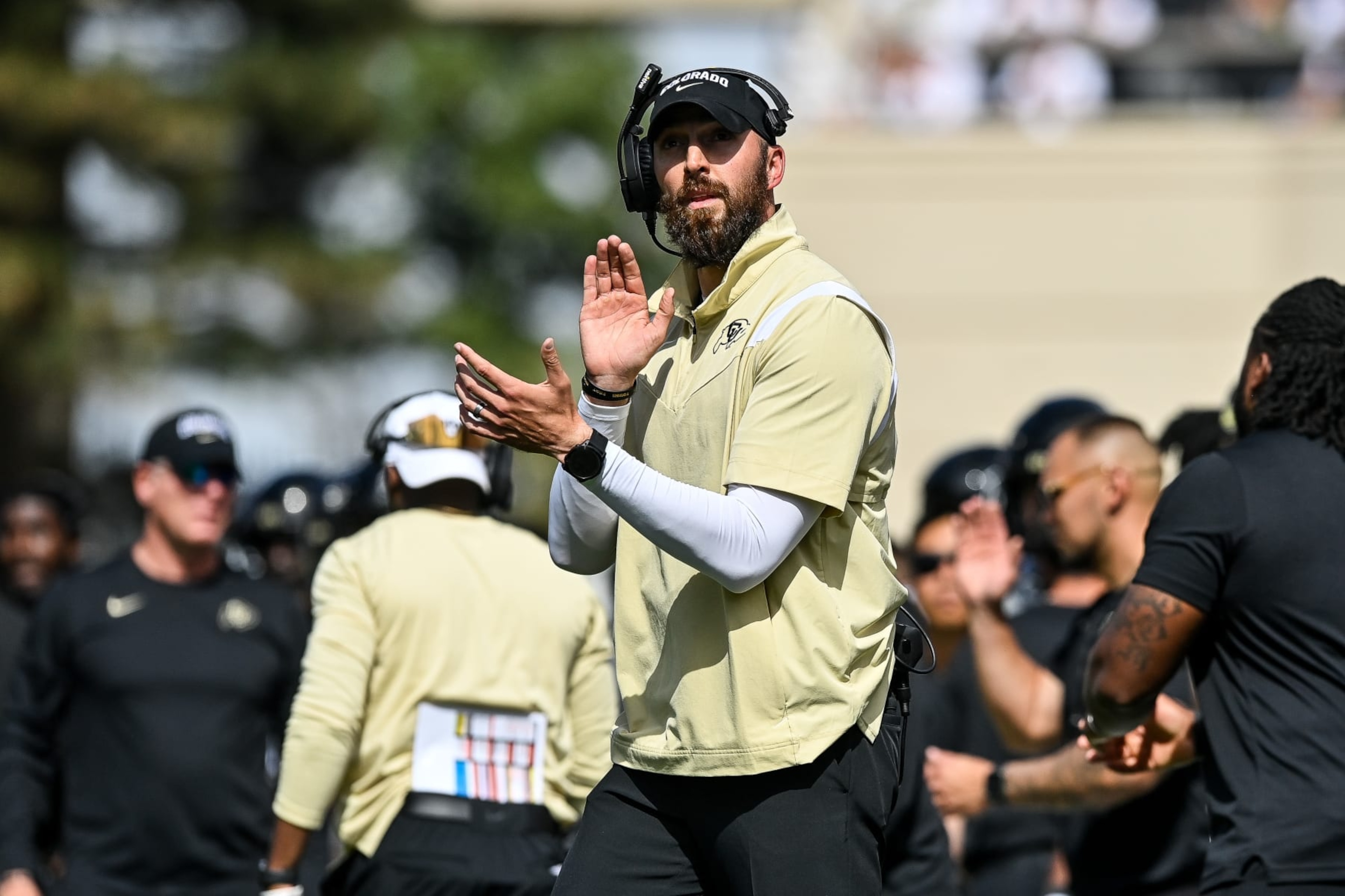 BOULDER, CO - SEPTEMBER 30: Offensive coordinator Sean Lewis of the Colorado Buffaloes claps after an offensive touchdown in the fourth quarter against the USC Trojans at Folsom Field on September 30, 2023 in Boulder, Colorado. (Photo by Dustin Bradford/Getty Images) BOULDER, CO - SEPTEMBER 30: Offensive coordinator Sean Lewis of the Colorado Buffaloes claps after an offensive touchdown in the fourth quarter against the USC Trojans at Folsom Field on September 30, 2023 in Boulder, Colorado. (Photo by Dustin Bradford/Getty Images)