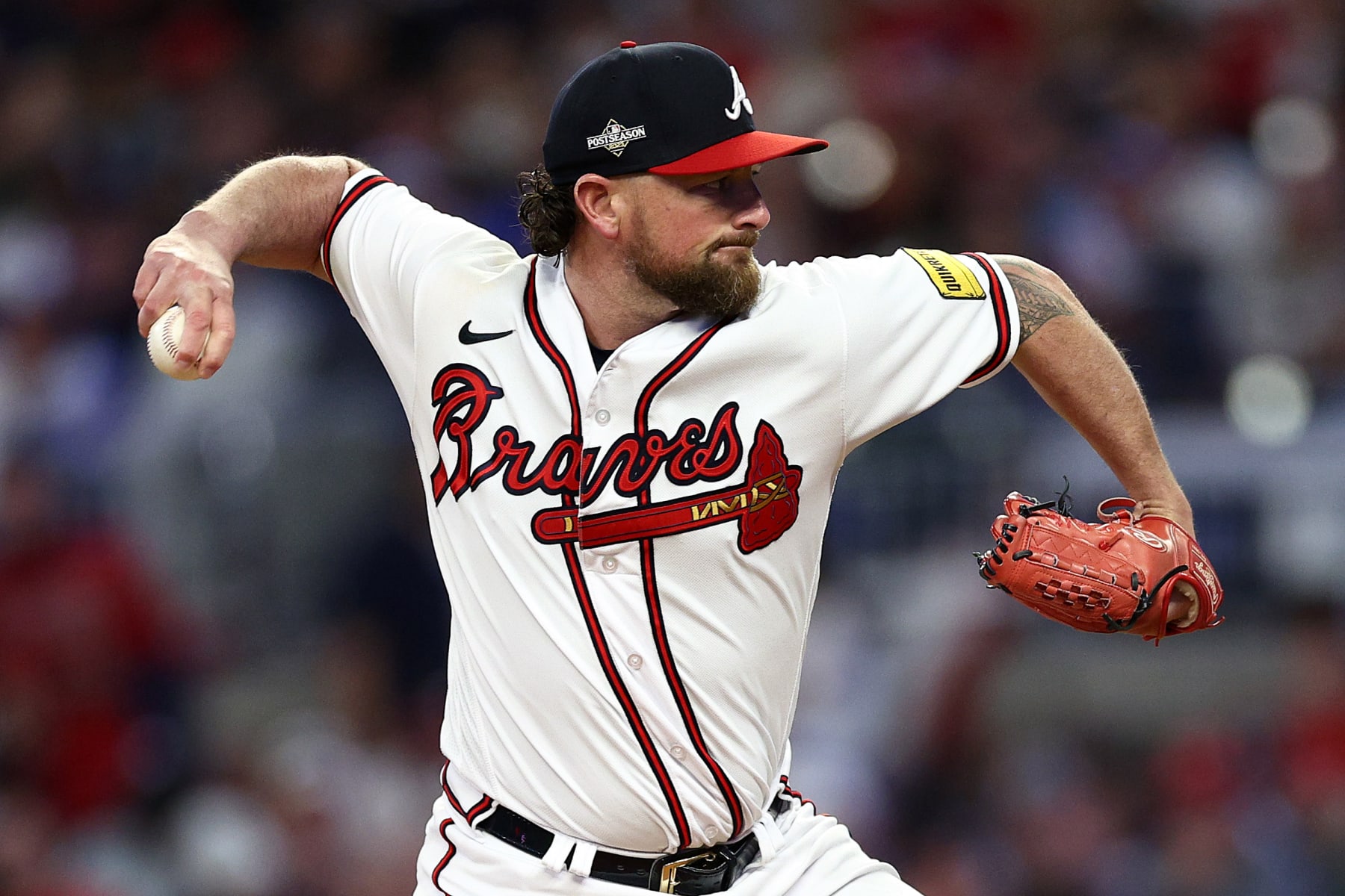 ATLANTA, GEORGIA - OCTOBER 09: Kirby Yates #22 of the Atlanta Braves pitches in the fifth inning against the Philadelphia Phillies during Game Two of the Division Series at Truist Park on October 09, 2023 in Atlanta, Georgia. (Photo by Elsa/Getty Images)