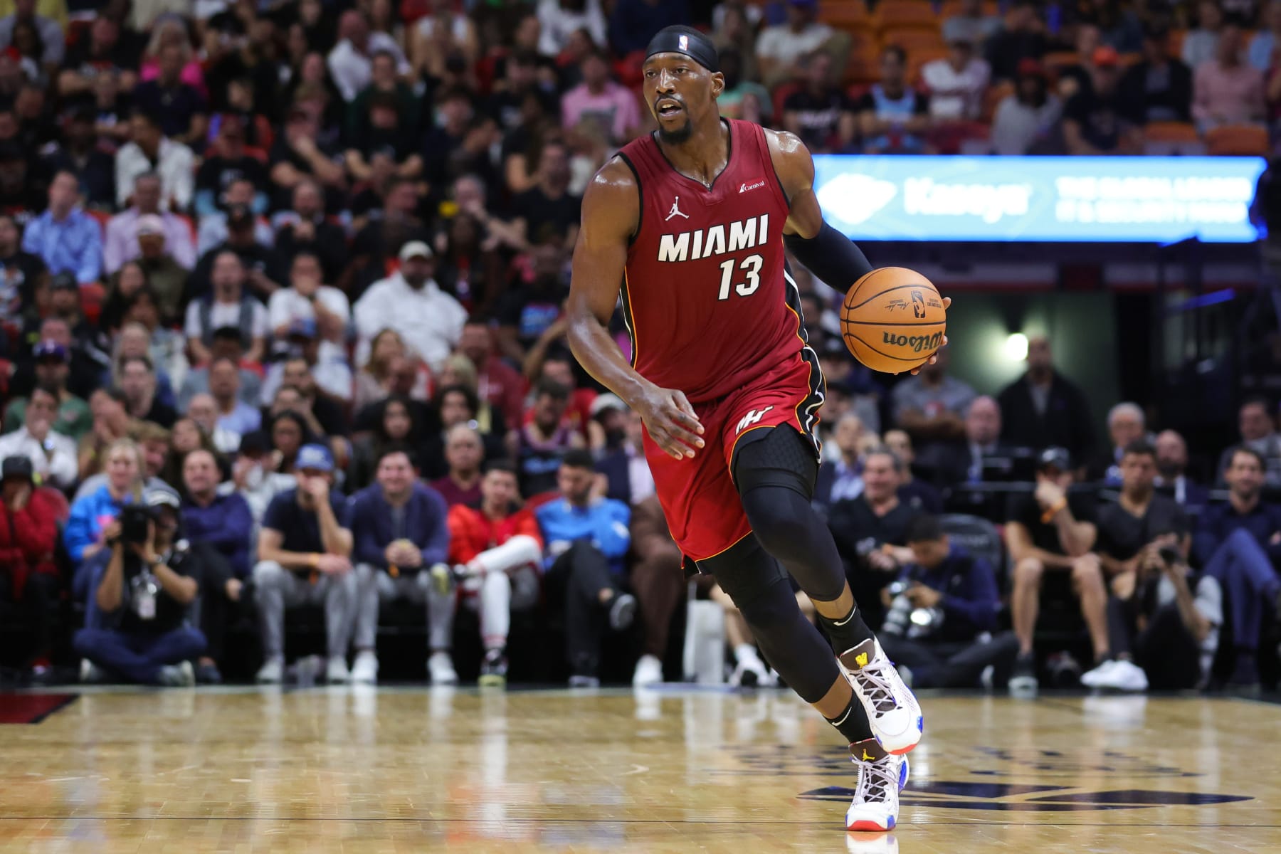 MIAMI, FLORIDA - NOVEMBER 30: Bam Adebayo #13 of the Miami Heat dribbles the ball against the Indiana Pacers during the second quarter of the game at Kaseya Center on November 30, 2023 in Miami, Florida. NOTE TO USER: User expressly acknowledges and agrees that, by downloading and or using this photograph, User is consenting to the terms and conditions of the Getty Images License Agreement. (Photo by Megan Briggs/Getty Images)