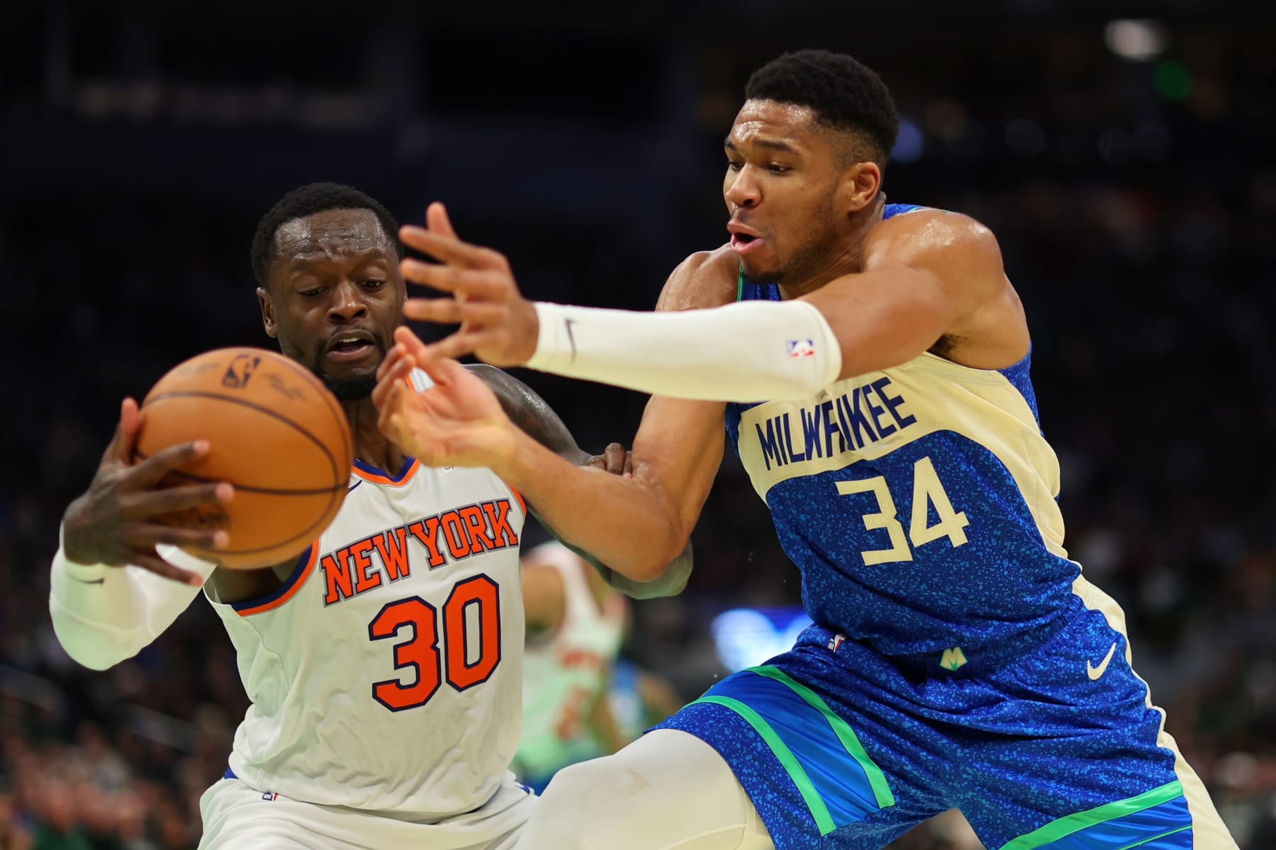 MILWAUKEE, WISCONSIN - DECEMBER 05: Giannis Antetokounmpo #34 of the Milwaukee Bucks is defended by Julius Randle #30 of the New York Knicks during the first half of the NBA In-Season Tournament Quarterfinal at Fiserv Forum on December 05, 2023 in Milwaukee, Wisconsin. NOTE TO USER: User expressly acknowledges and agrees that, by downloading and or using this photograph, User is consenting to the terms and conditions of the Getty Images License Agreement. (Photo by Stacy Revere/Getty Images)