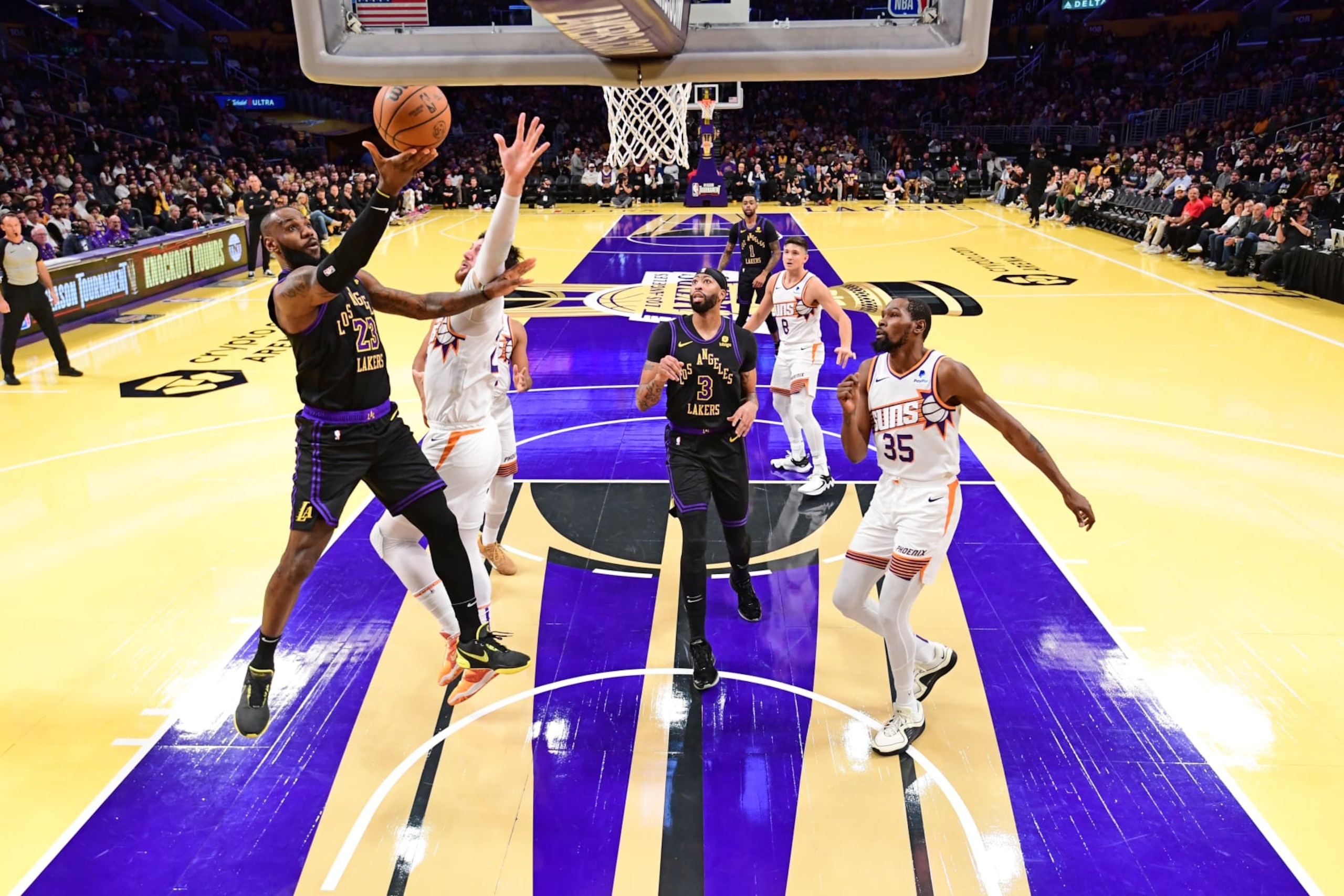 LOS ANGELES, CA - DECEMBER 5: LeBron James #23 of the Los Angeles Lakers drives to the basket during the game against the Phoenix Suns during the Quarterfinals of the In-Season Tournament on December 5, 2023 at Crypto.Com Arena in Los Angeles, California. NOTE TO USER: User expressly acknowledges and agrees that, by downloading and/or using this Photograph, user is consenting to the terms and conditions of the Getty Images License Agreement. Mandatory Copyright Notice: Copyright 2023 NBAE (Photo by Adam Pantozzi/NBAE via Getty Images) LOS ANGELES, CA - DECEMBER 5: LeBron James #23 of the Los Angeles Lakers drives to the basket during the game against the Phoenix Suns during the Quarterfinals of the In-Season Tournament on December 5, 2023 at Crypto.Com Arena in Los Angeles, California. NOTE TO USER: User expressly acknowledges and agrees that, by downloading and/or using this Photograph, user is consenting to the terms and conditions of the Getty Images License Agreement. Mandatory Copyright Notice: Copyright 2023 NBAE (Photo by Adam Pantozzi/NBAE via Getty Images)